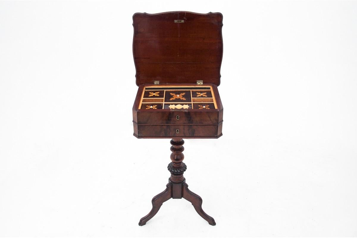 A thread table from the second half of the 19th century in the Biedermeier style.

A small piece of furniture, a bit forgotten today, but once a must-have for a housewife for needlework. The table consists of two drawers, the upper one with many
