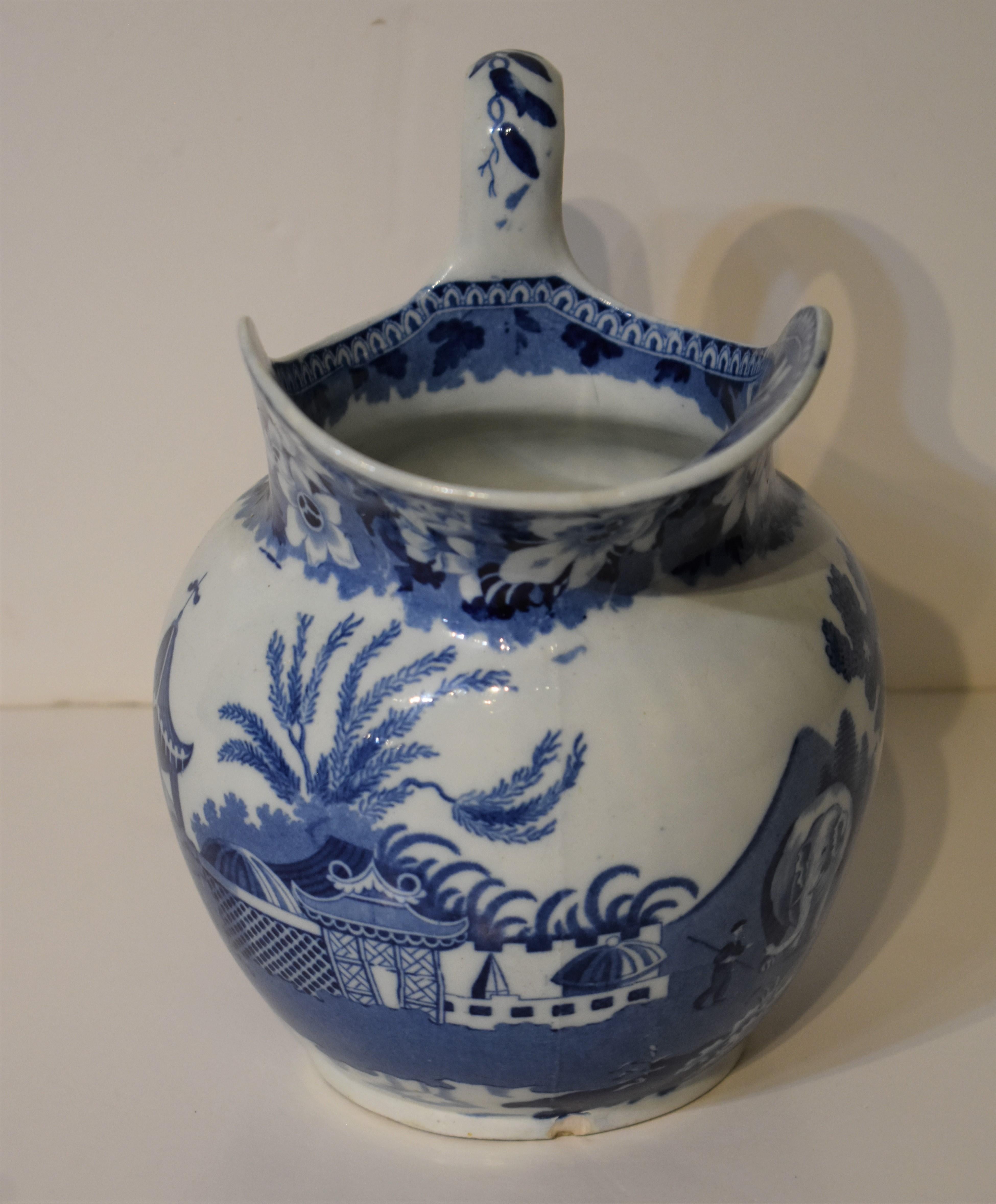 Blue and white staffordshire pitcher with chinoiserie design including exotic motifs. No makers mark,. No apparent restoration or damage