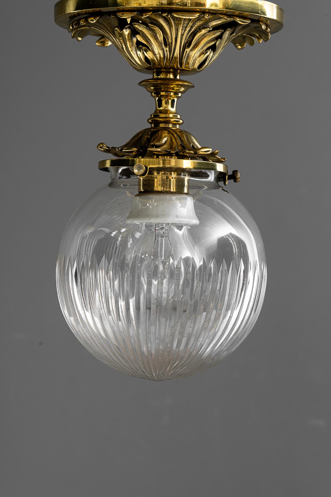 Historistic brass ceiling lamp with cut glass shade vienna around 1890s
Brass polished and stove enameled
Original cut glass shade