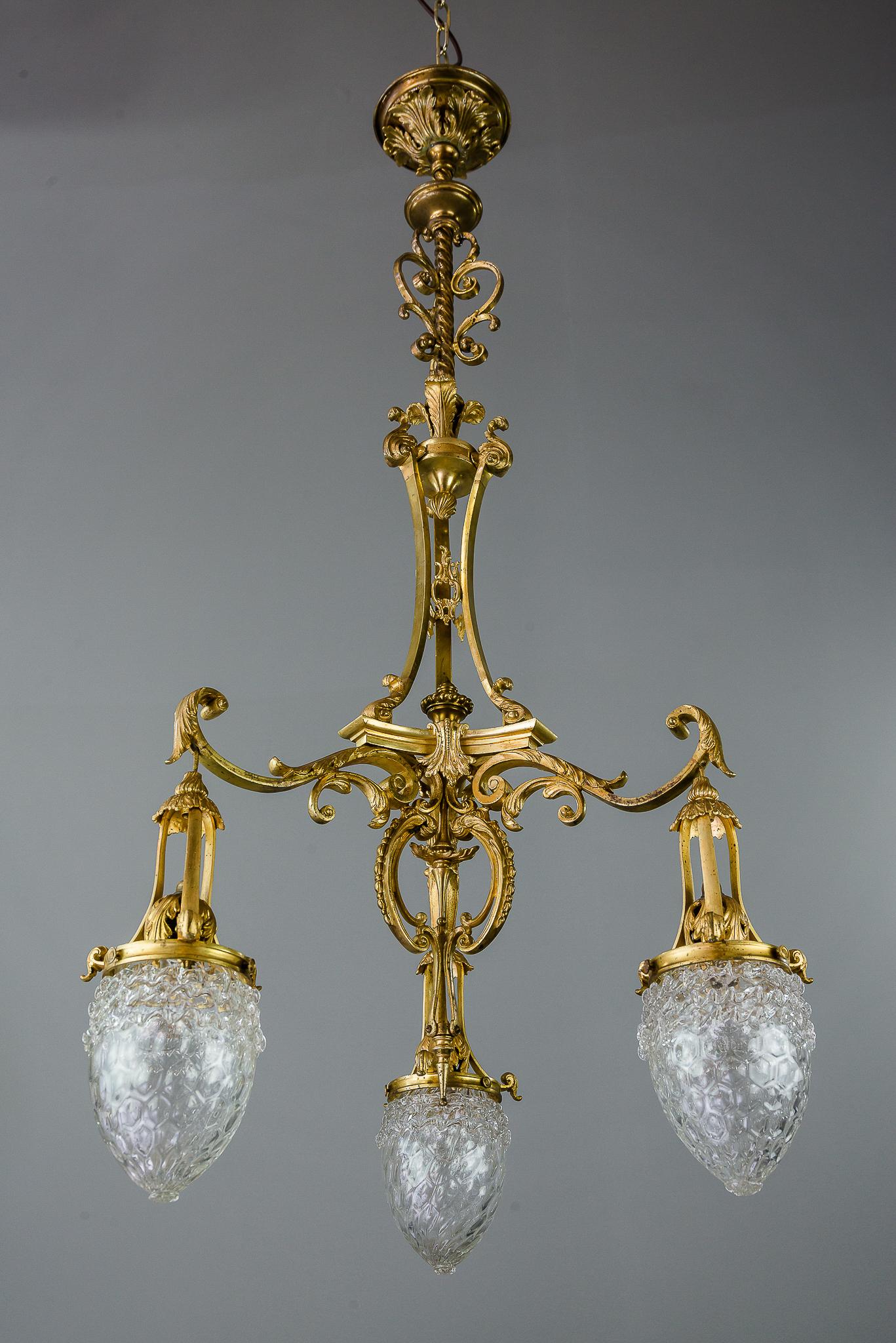 Historistic chandelier gilded with original glasses, circa 1890s
The chandelier is made of brass and gilded.
Very beautiful original condition.
The chandelier is made of massiv brass (heavy chandelier)
Very interesting design of the glass