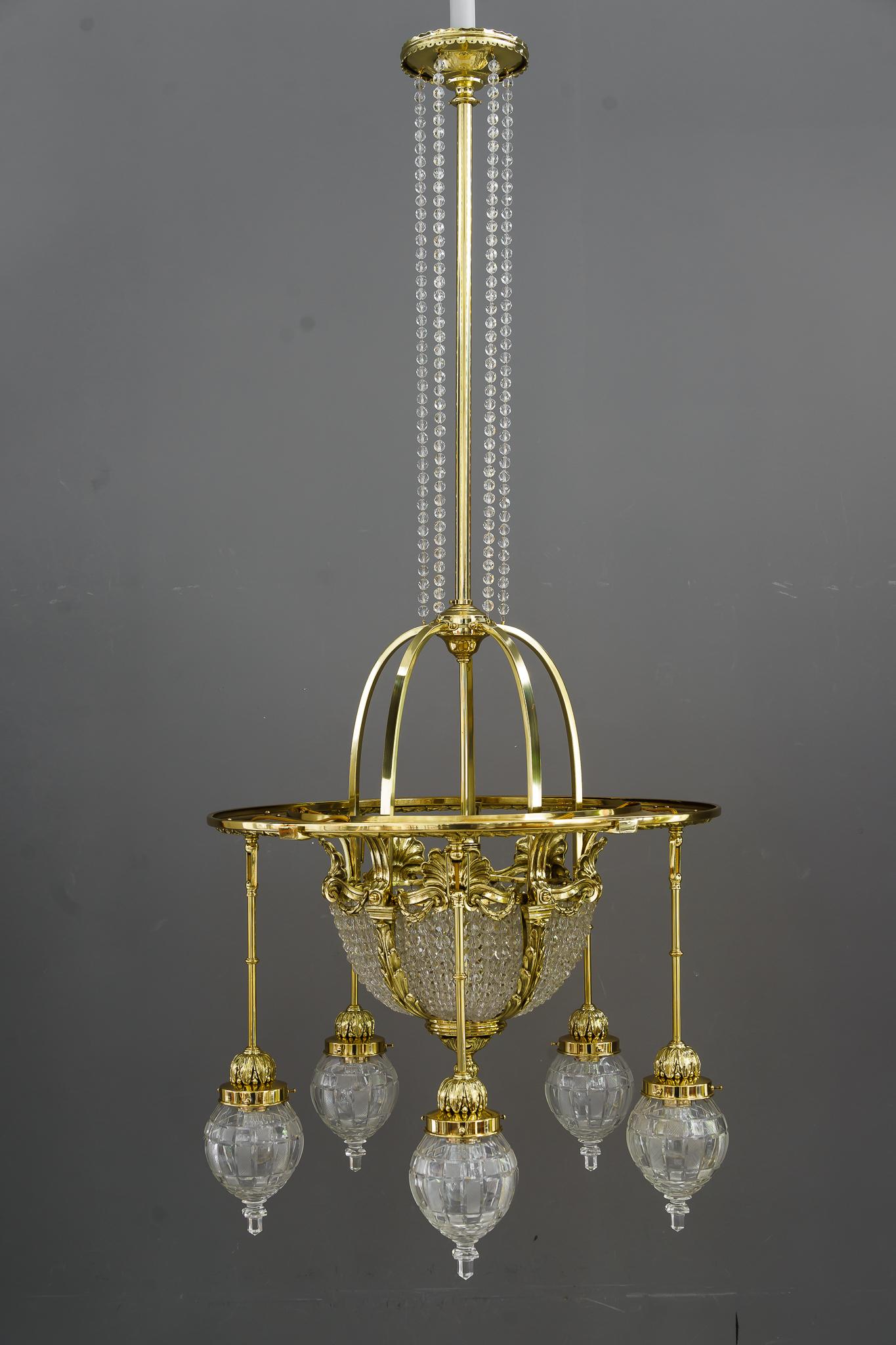 Historistic chandelier with original cut glass shades vienna around 1890s 
Very hight quality chandelier
Brass polished and stove enameled
Original cut glass shades.
  