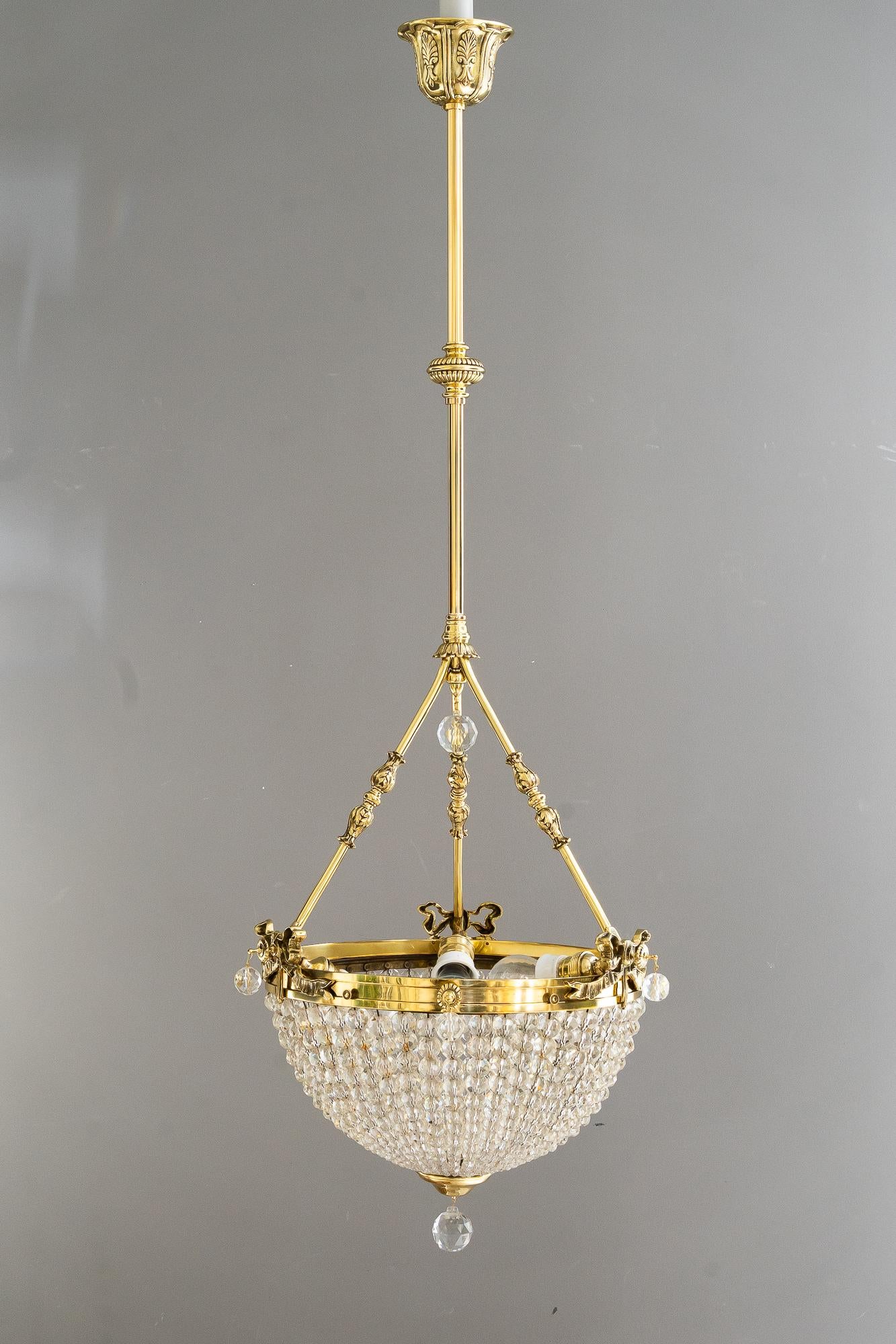 Historistic crystal basket chandelier vienna around 1890s
Original crystal glass
Brass polished and stove enameled