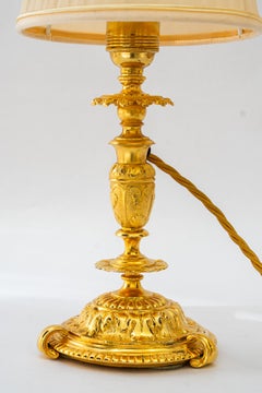 Historistic fire gilted table lamp with fabric shade vienna around 1890s