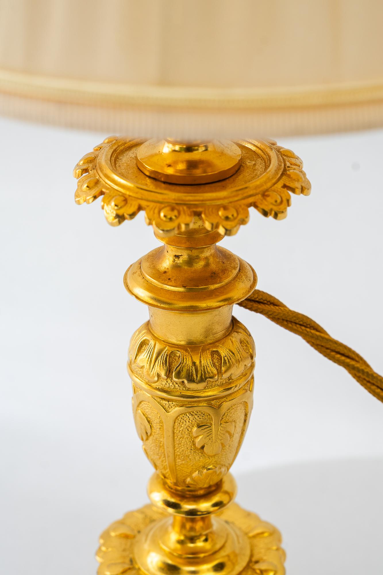Late 19th Century Historistic fire gilted table lamp with fabric shade vienna around 1890s For Sale