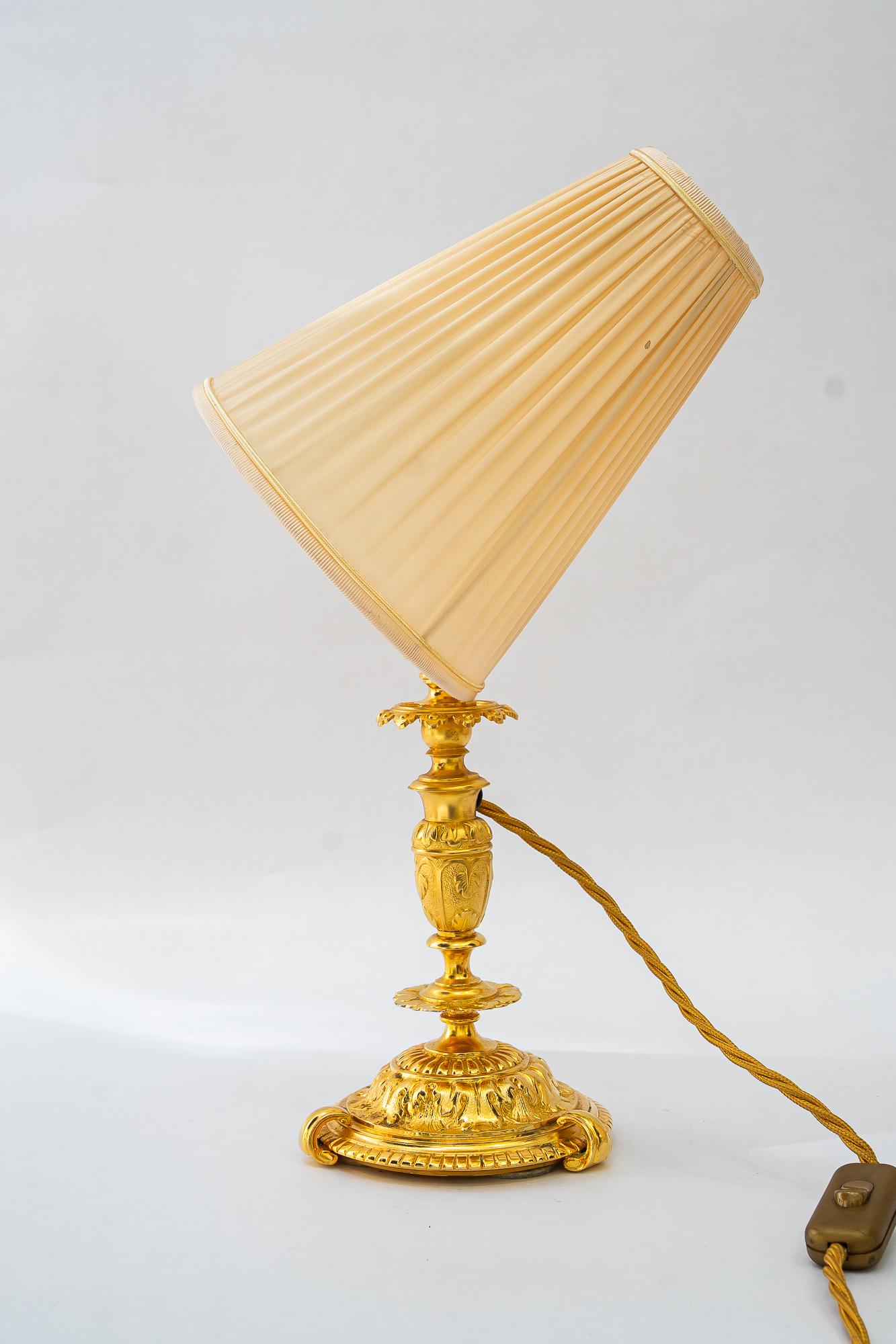 Historistic fire gilted table lamp with fabric shade vienna around 1890s For Sale 1
