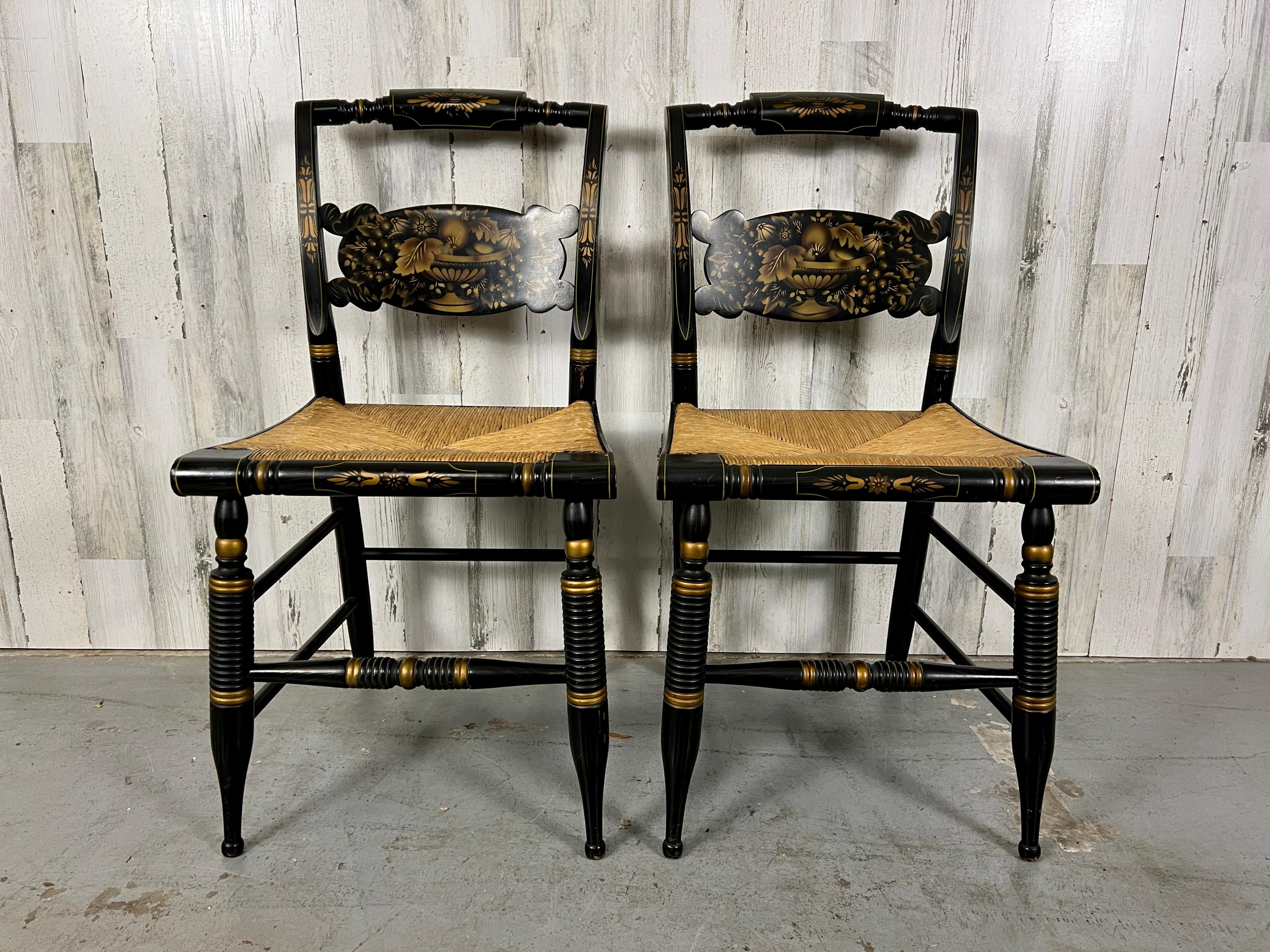late 20th Century ebonized side chairs with gold etching hand painted design & rush seats. 