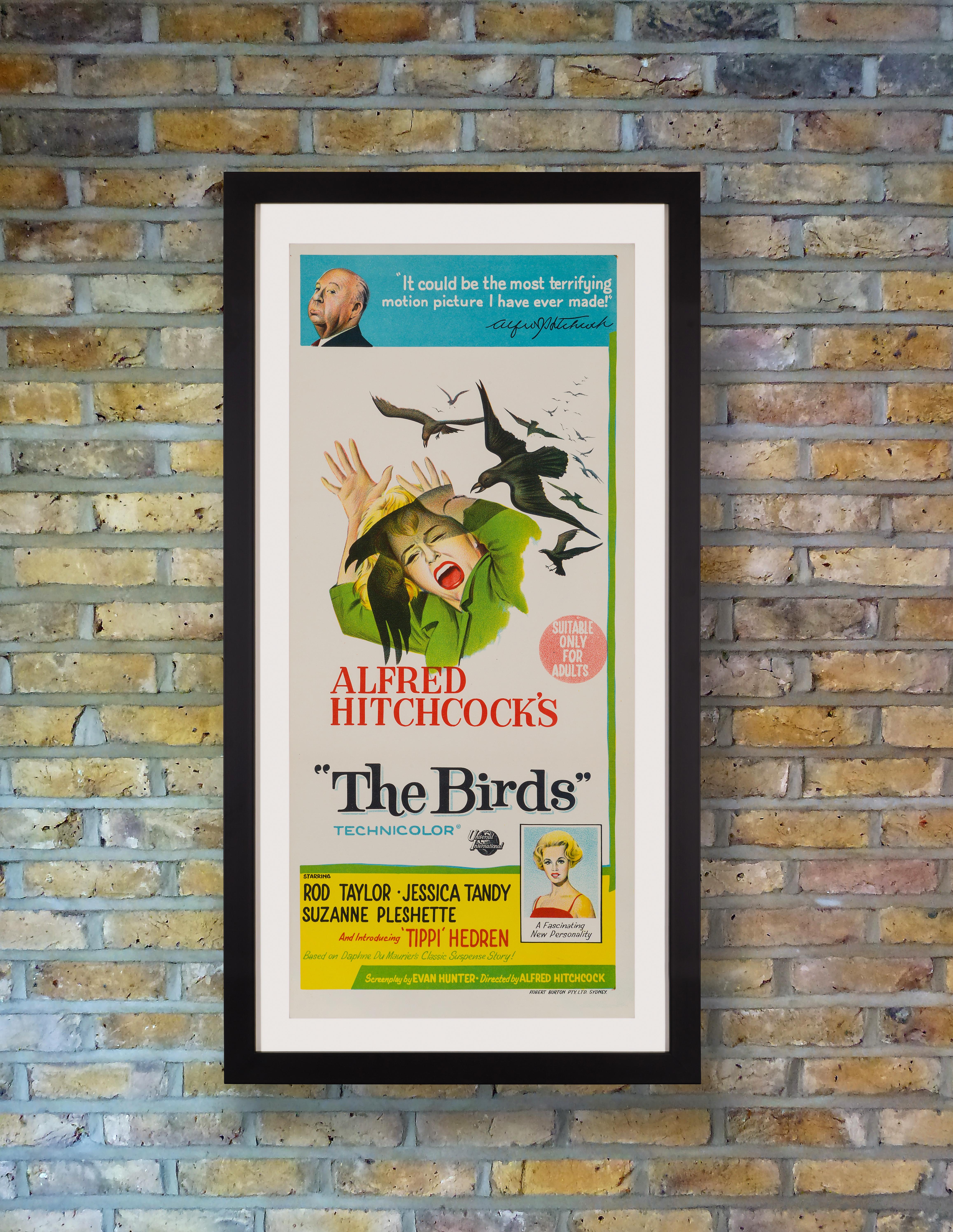 A stunning stone lithography poster for Alfred Hitchcock's psychological masterpiece 'The Birds,' based on Daphne du Maurier's 1952 short story of the same name, starring Tippi Hendren in her debut role. The suspense-filled thriller set in an eerie