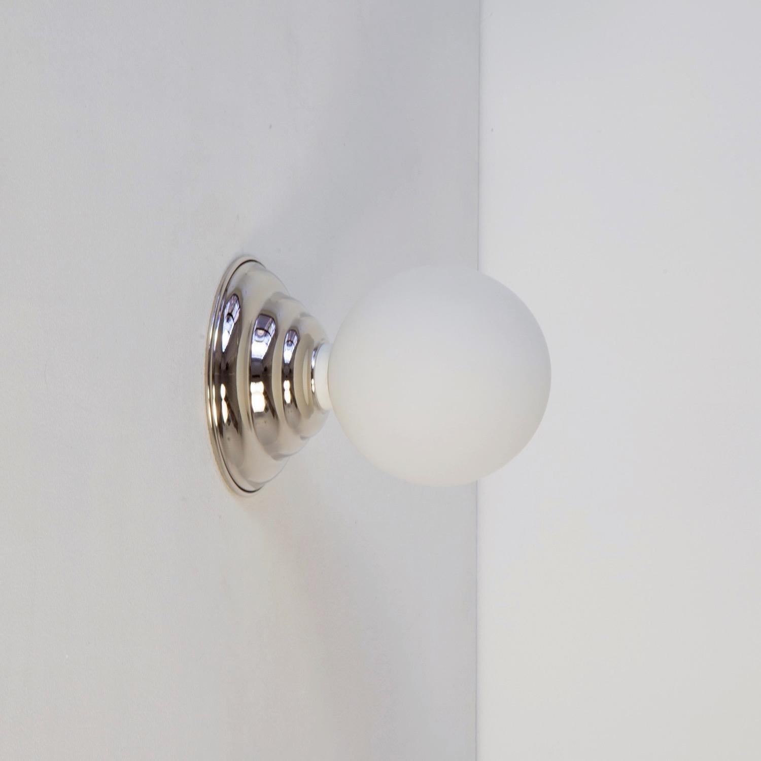 This listing is for 1x Hive Sconce in polished nickel designed and manufactured by Research.Lighting.

Materials: Brass, Steel & Glass
Finish: Polished Nickel
Globe Size: ~4.75in
Electronics: 1x G9 Socket, 1x 4.5 Watt LED Bulb (included), 450