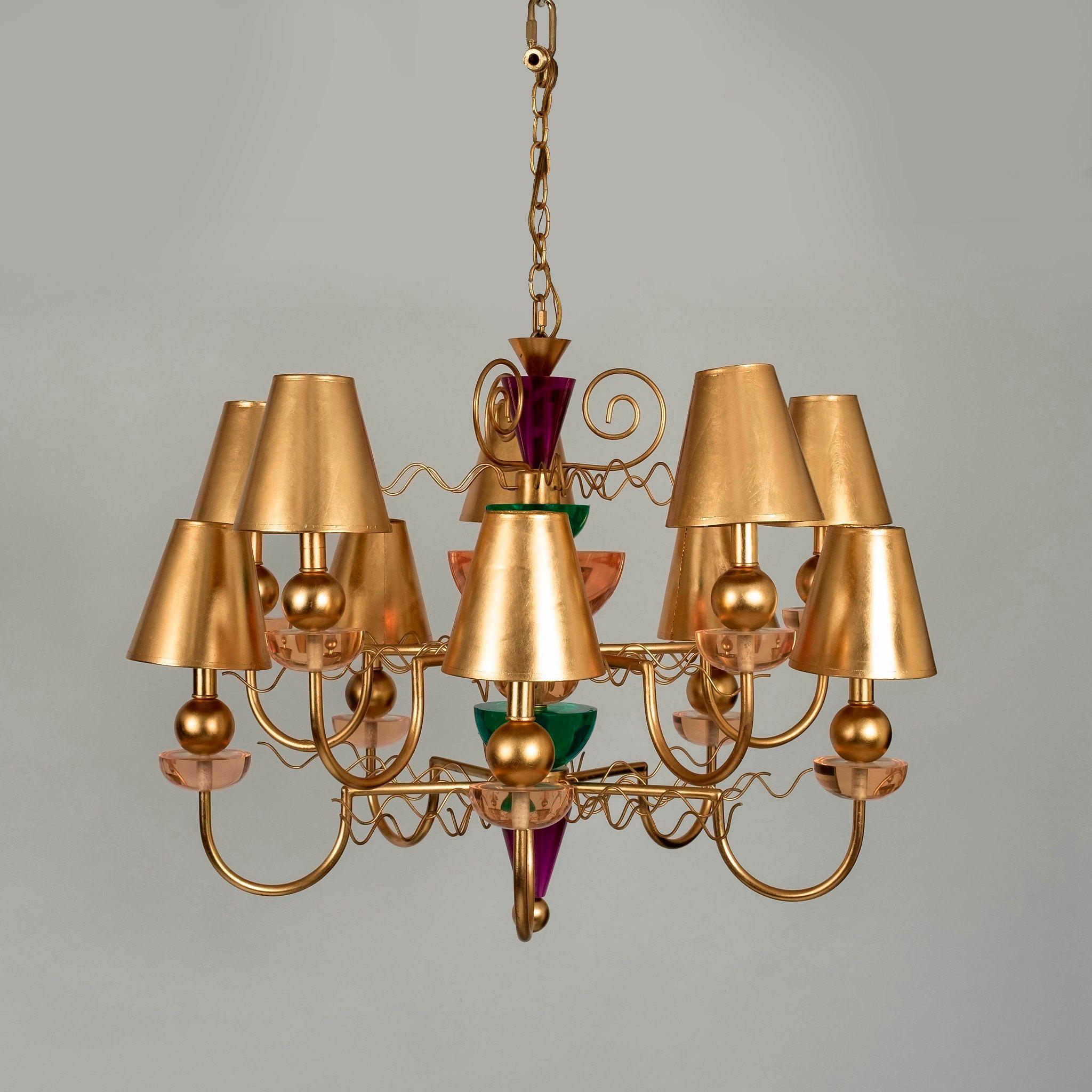Avant garde ten light Memphis style Hivo Van teal chandelier. This gilt metal chandelier features multicolored hand crafted lucite and handmade gilt paper shades.