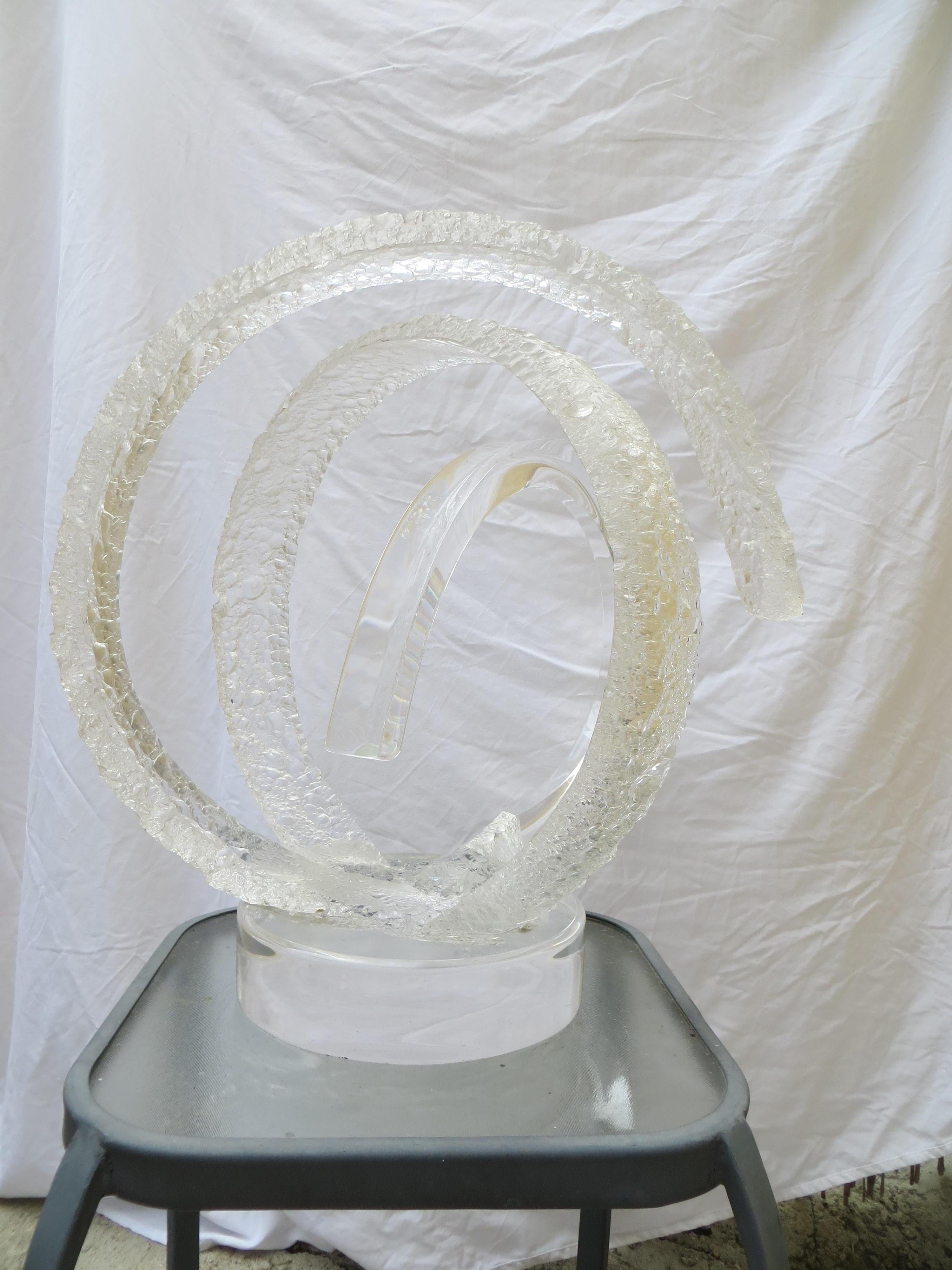 Signed Van Teal Lucite monumental sculpture large circular frosted and clear design. Perfect for the Hollywood Regency or Mid Century Modern décor
After fleeing Havana as a young man, Hivo Van Teal was able to unleash his artistic sensibilities and