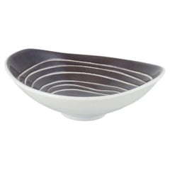 Hjördis Oldfors, Upsala-Ekeby. Asymmetrical ceramic bowl with linear decoration.