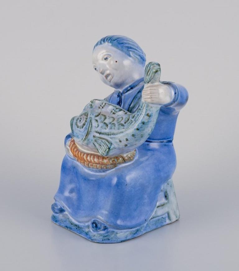 Scandinavian Modern Hjorth, Bornholm, Denmark, fisherwoman figurine in glazed ceramic. Mid-20th C. For Sale