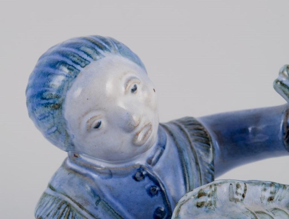 Hjorth, Bornholm, Denmark, fisherwoman figurine in glazed ceramic. Mid-20th C. In Excellent Condition For Sale In Copenhagen, DK