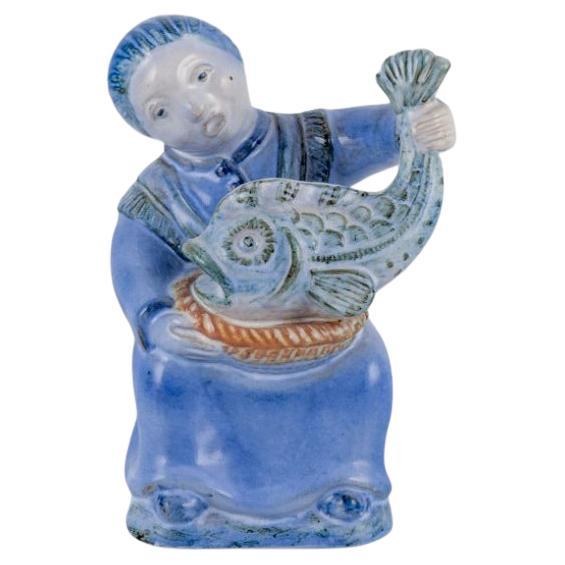Hjorth, Bornholm, Denmark, fisherwoman figurine in glazed ceramic. Mid-20th C. For Sale