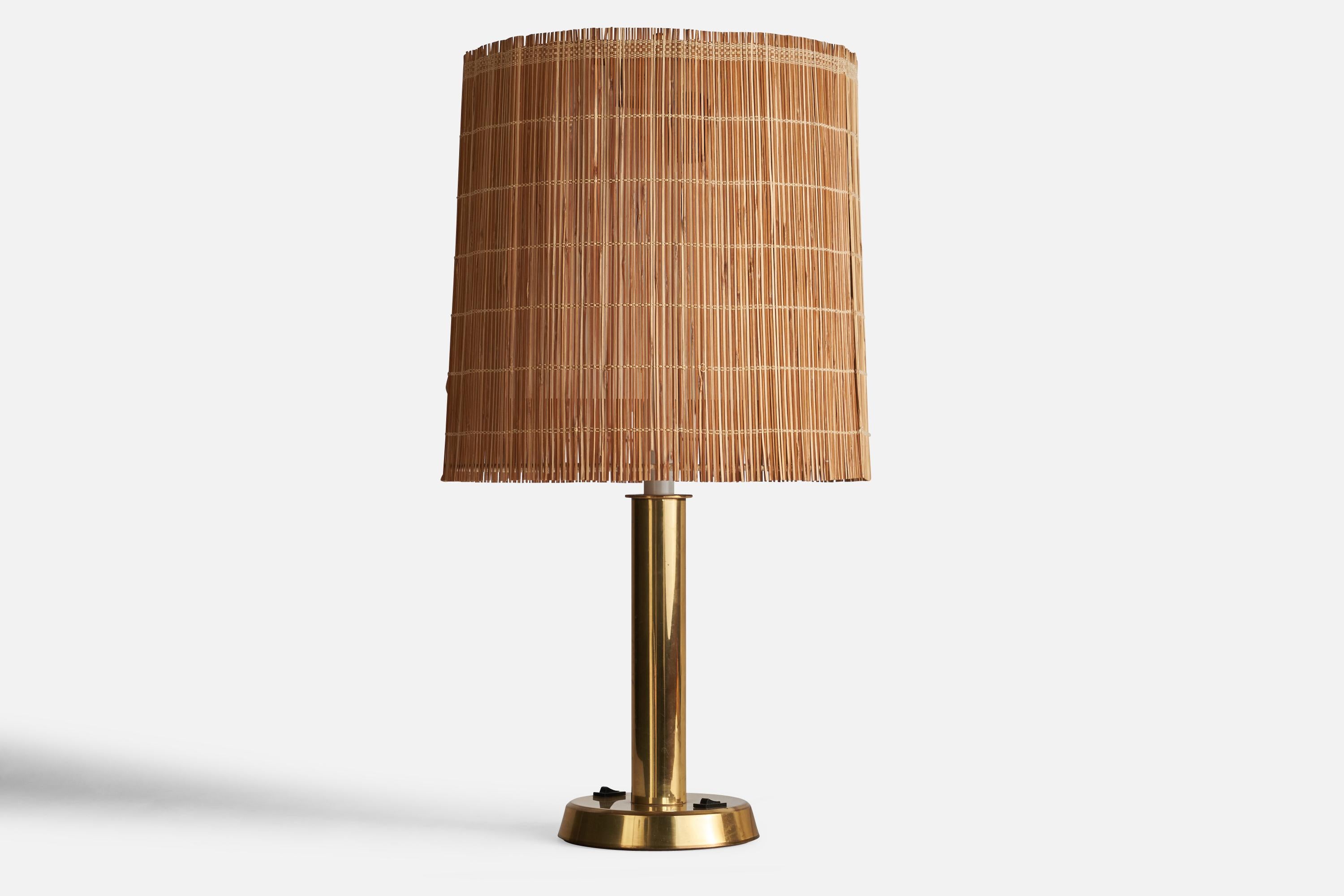 A sizeable brass and woven reed table lamp designed and produced by HK Aro, Finland, 1960s.

Overall Dimensions (inches): 28.65” H x 14” Diameter
Bulb Specifications: E-26 Bulbs
Number of Sockets: 2
 
 
All lighting will be converted for US usage.