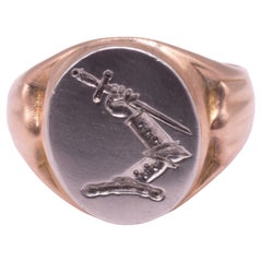 HM 1989 18K and Platinum Signet Ring of Armoured Arm Grasping Sword