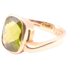 HM 2001 18K Peridot Solitaire Ring with an Asymmetrical Gold Band