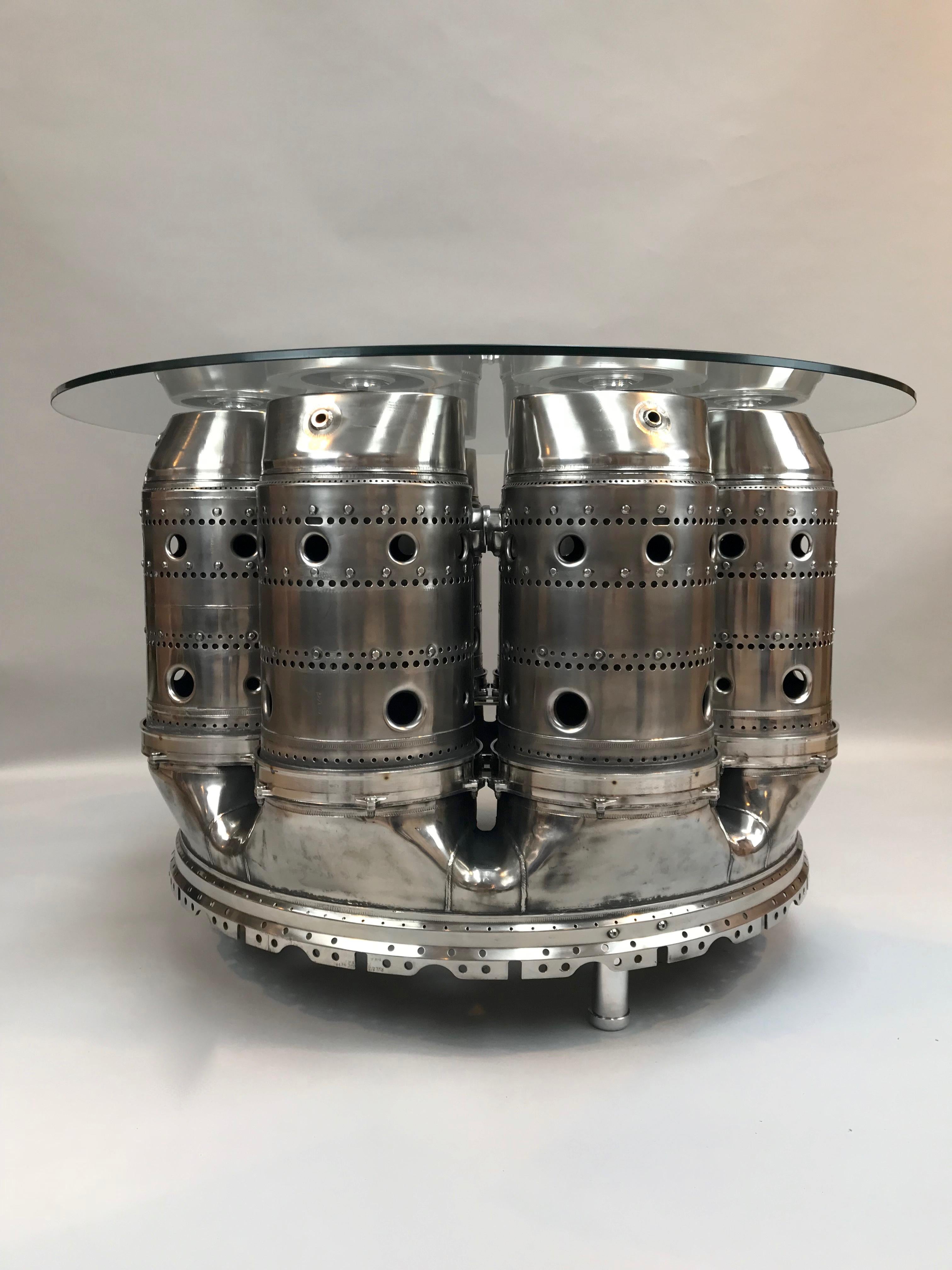 Own a piece of British Marine History with this HMS Bristol Olympus TM1A turbine engine table!
A very unique table created with the burner can section from a gas turbine used on Type 82 Destroyer (HMS Bristol).

Comfortable seating from 4-8