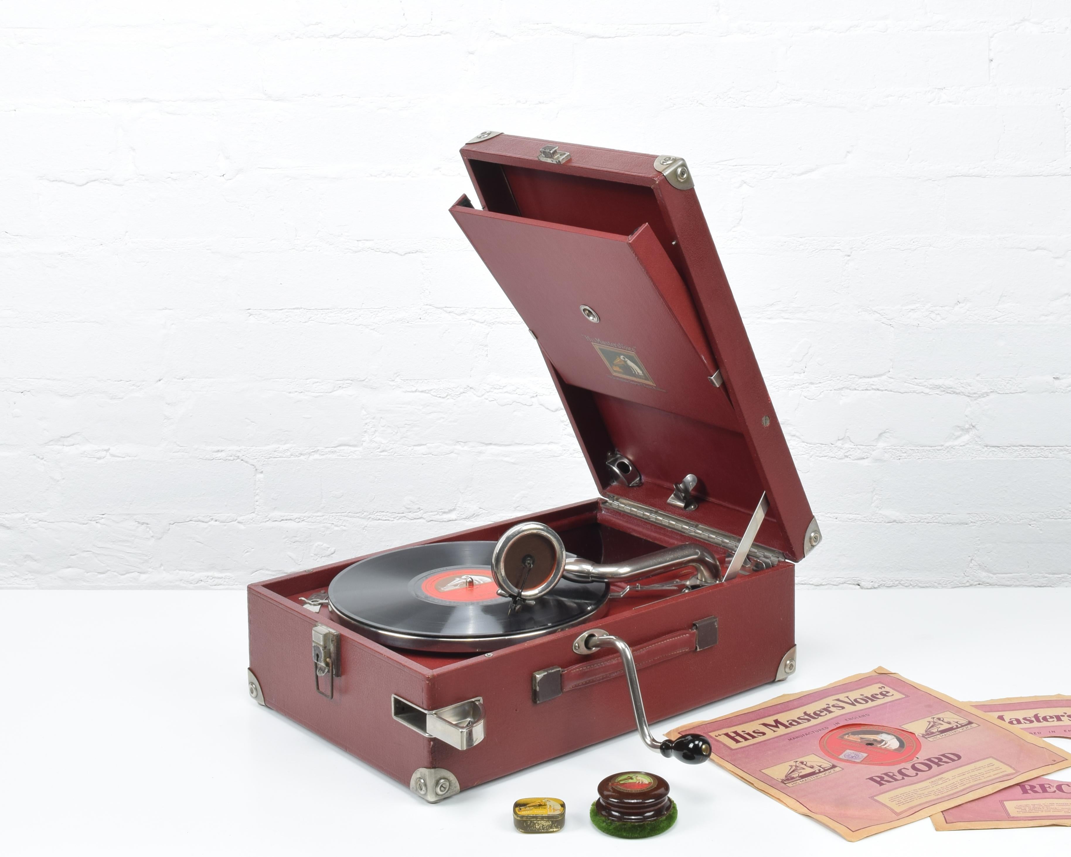 The HMV Model 101 portable Gramophone was originally introduced in about 1925. It was, and is, still considered to be one of the best portable wind-up gramophones ever produced.

Super original condition. Red Rexine leather-cloth, Red metal and