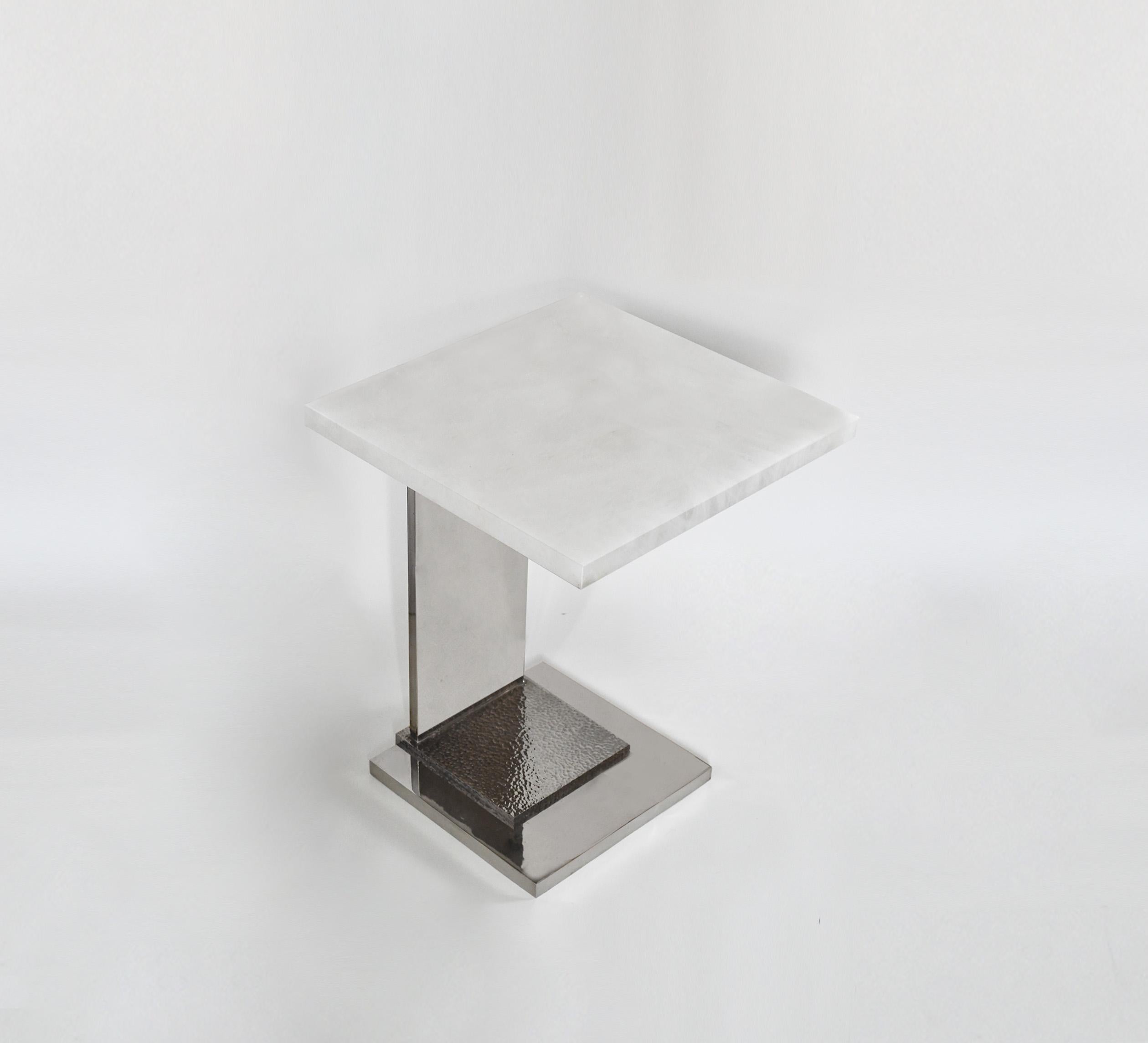 Rock crystal side table with nickel plating base, hammered detail. Created by Phoenix Gallery, NYC.
Quantity and finish upon request.
