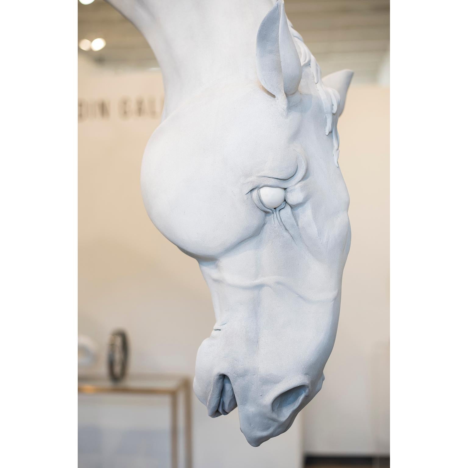The Horse by Hobbes Vincent is an original sculpture.
Epoxy resin plaster and bronze sculpture. 
150 × 96 × 36 inch; 381 × 243.8 × 91.4 cm

The Horse, from his solo exhibition, At the Circus. The white horse is being lifted by a strong man and the 7
