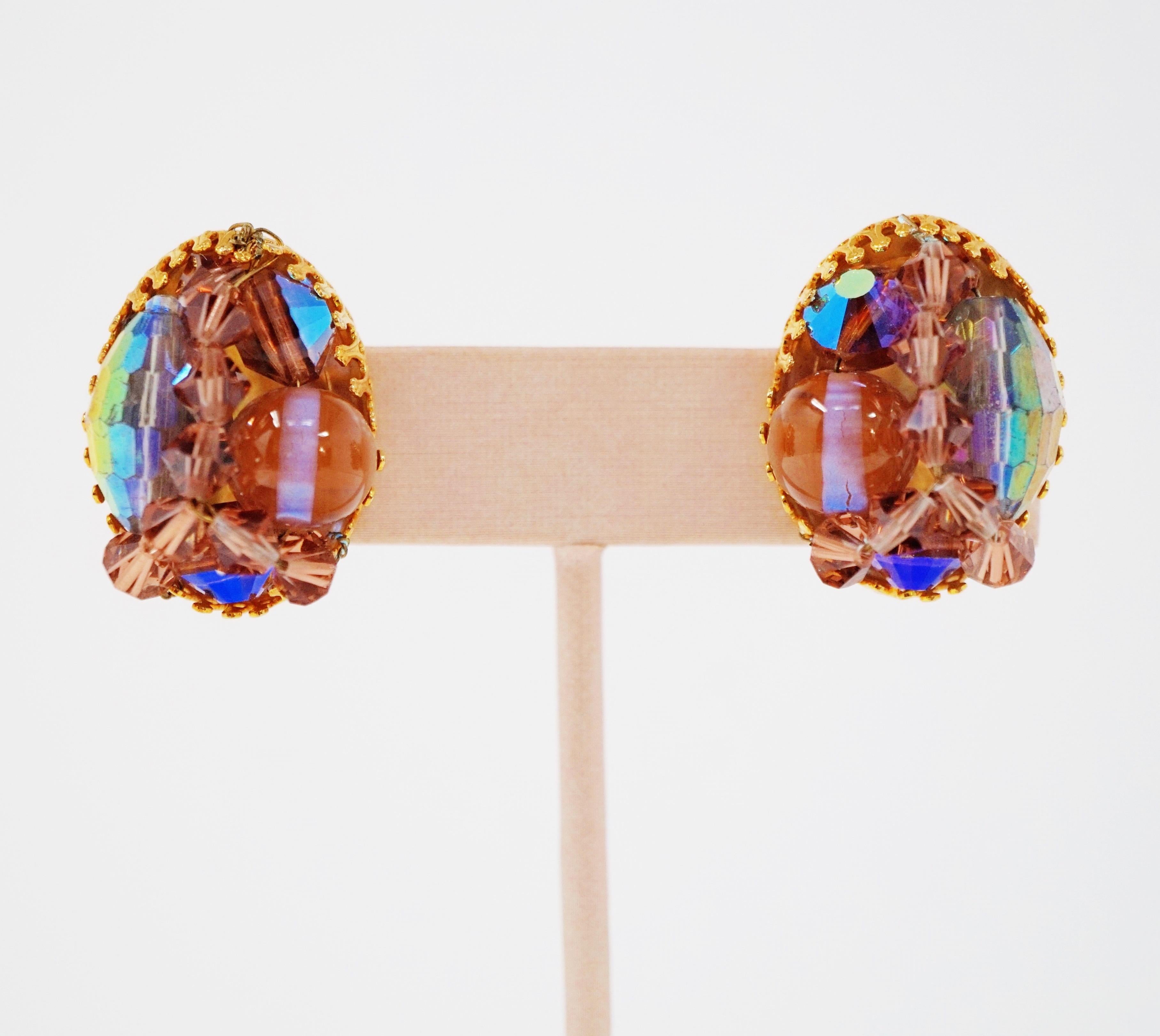 These gorgeous circa 1970s Hobé Aurora Borealis crystal cluster clip-on earrings are an extremely collectible piece of design history, and are as stylistically relevant today as when they were first designed. The Hobé hallmark is signed on the