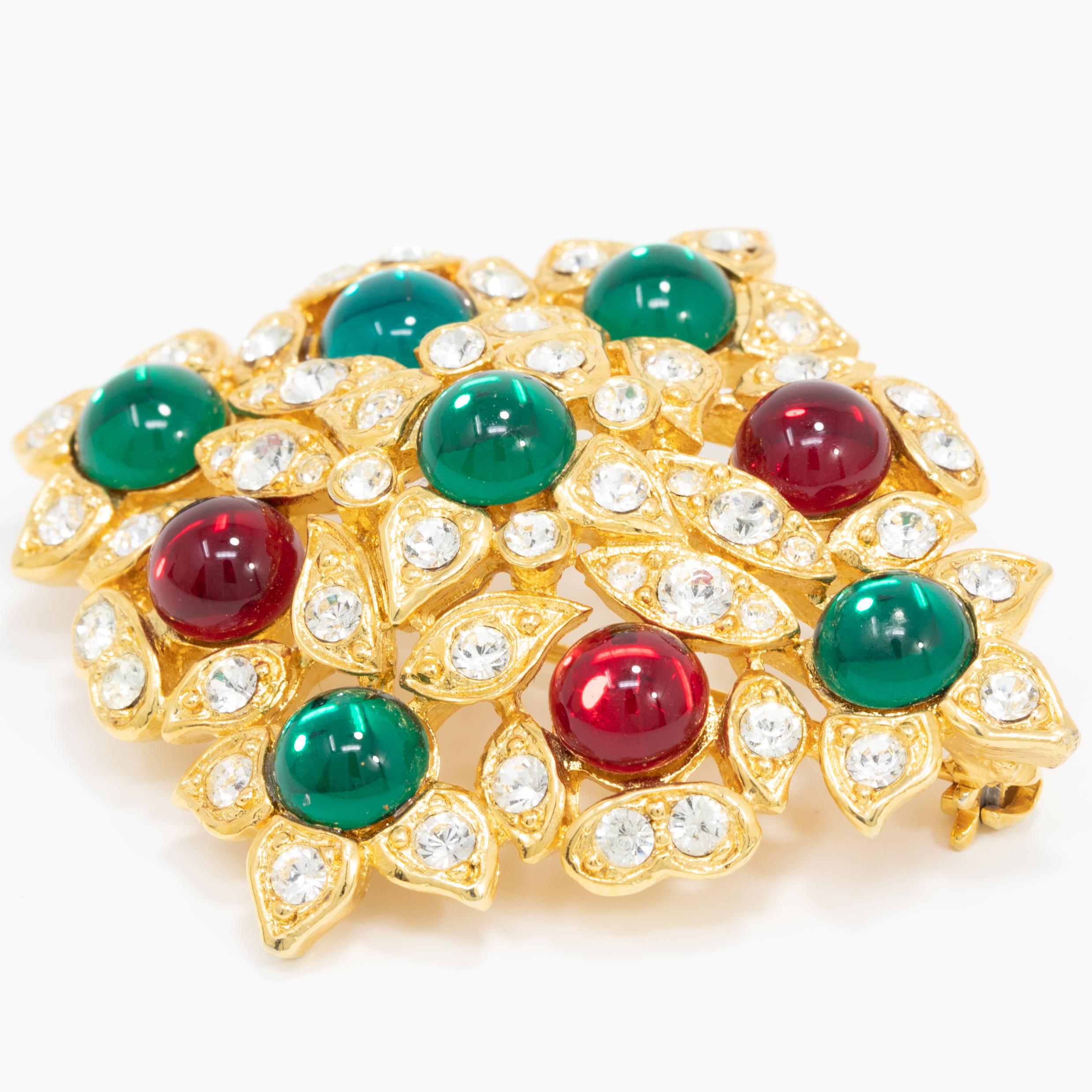 A colorful vintage pin from Hobe. Features vibrant red and green cabochons, accented with crystals and set on a gold-plated setting.

Mid 1900s.

Hallmarks/Marks/Signs: Hobe