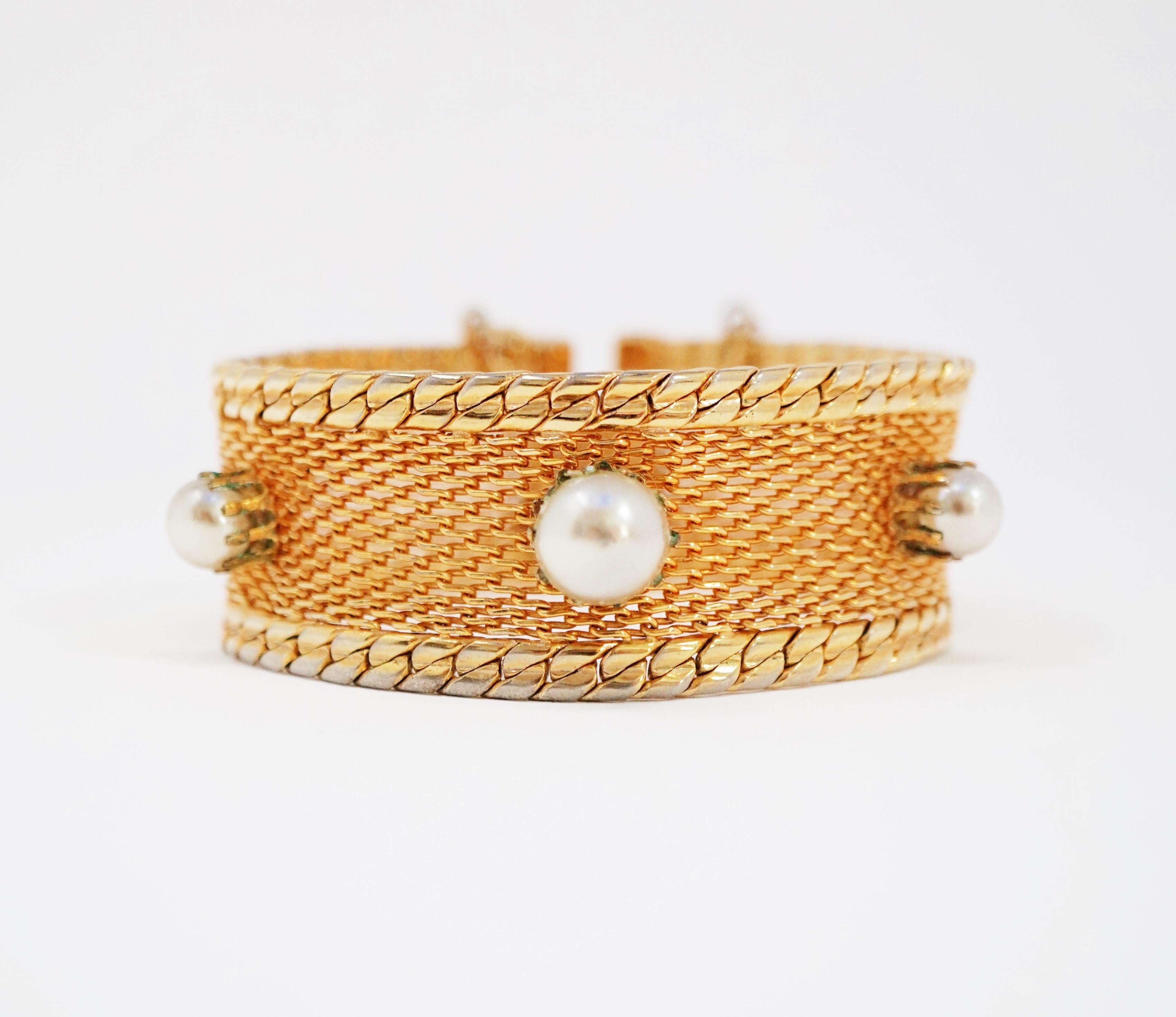 This gorgeous circa 1960s Hobé mesh bracelet features five gray freshwater pearls prong set on gold tone mesh.  An extremely collectible piece of design history, this bracelet is stylistically relevant today as it was when it was first designed. The