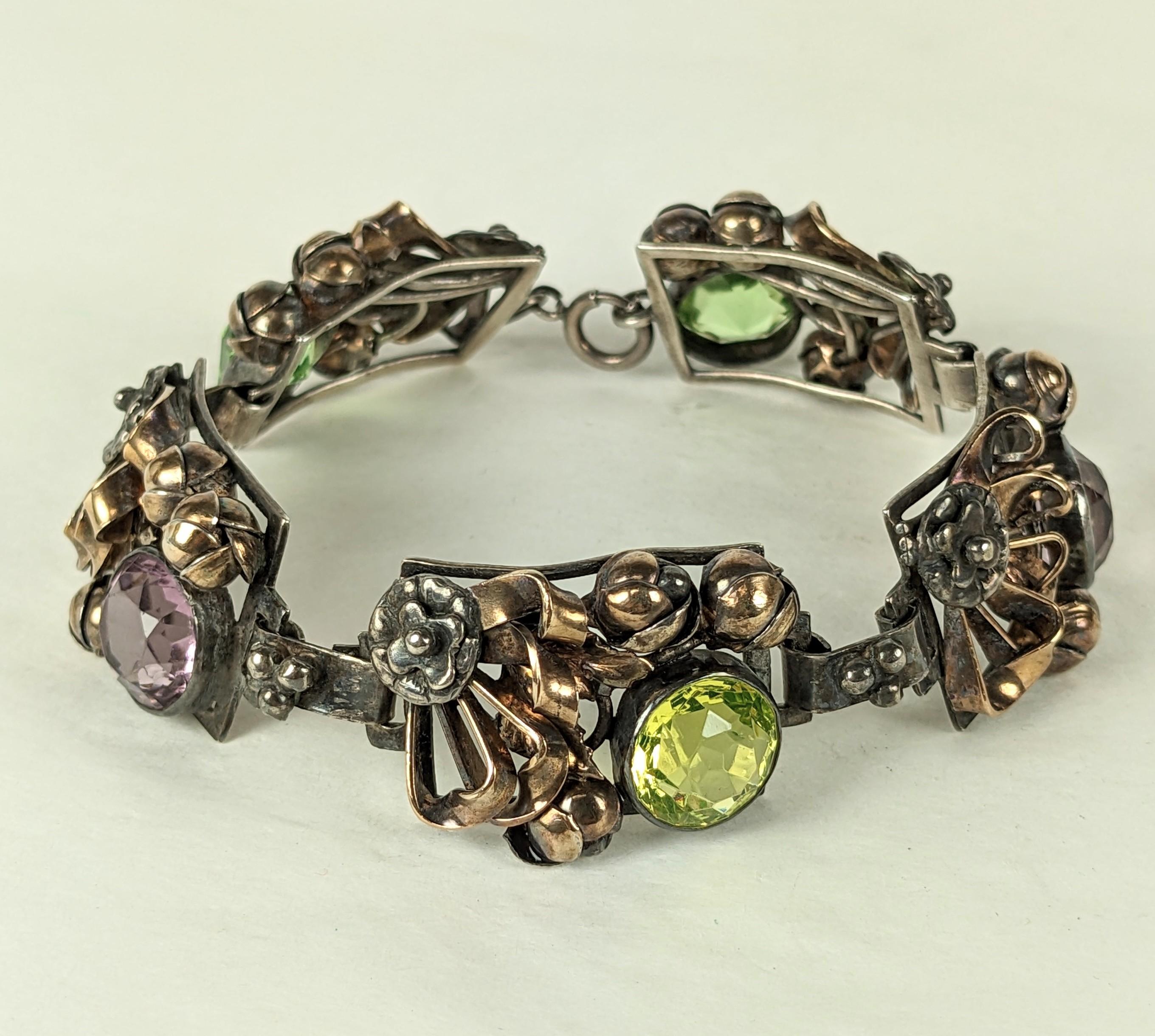 Hobe Sterling Vermeil Crystal Link Bracelet from the 1940's. Handmade with crystals in pink and limey green set in links with flower buds of sterling and rose gold vermeil. Unsigned. 8