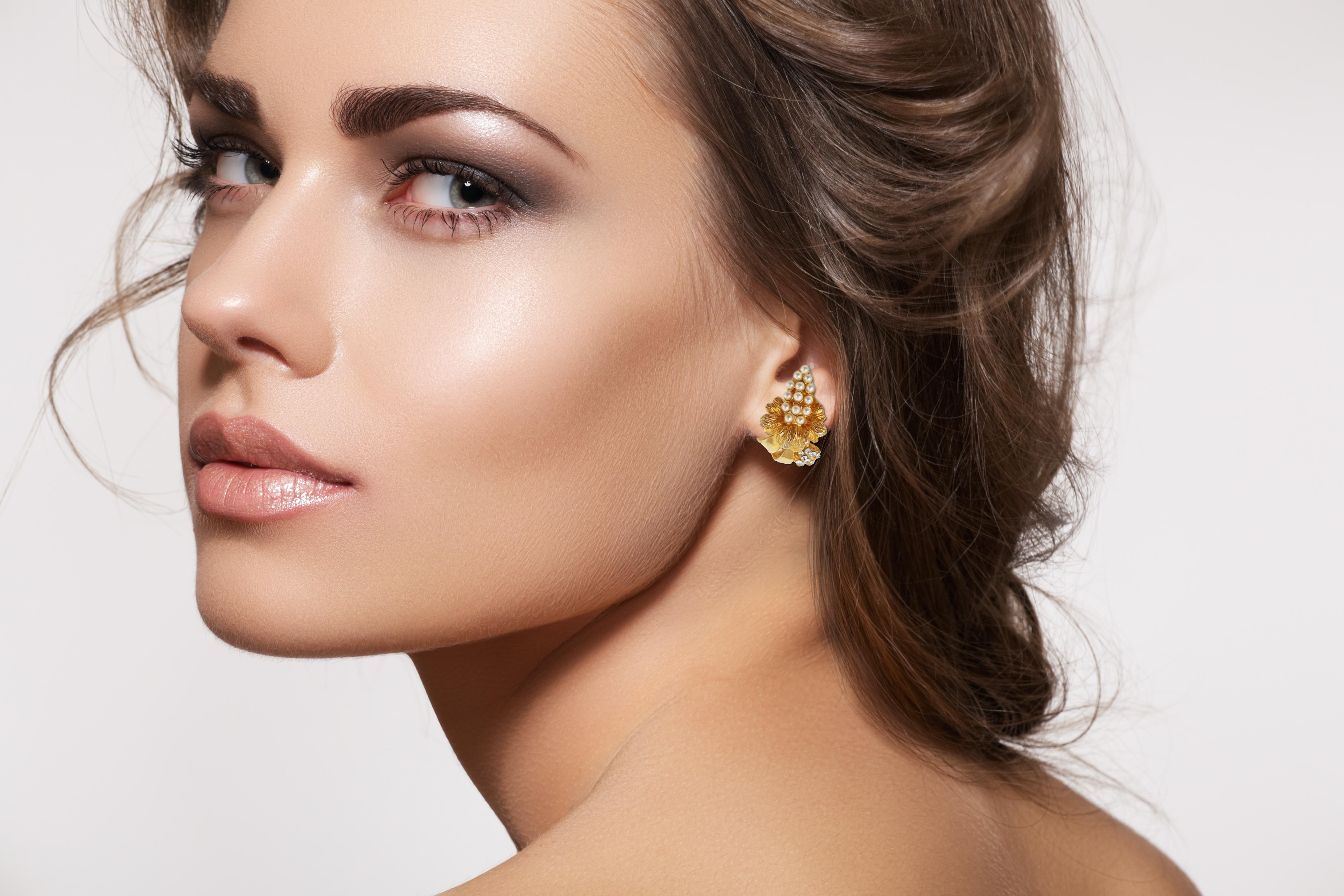 Gorgeous Hobé clip-on statement earrings, circa 1950s, featuring faux pearl and crystal rhinestone accents and vibrant gold-plating.  These chic earrings make an excellent addition to your vintage jewelry collection.

ABOUT HOBÉ:
Hobé was founded by