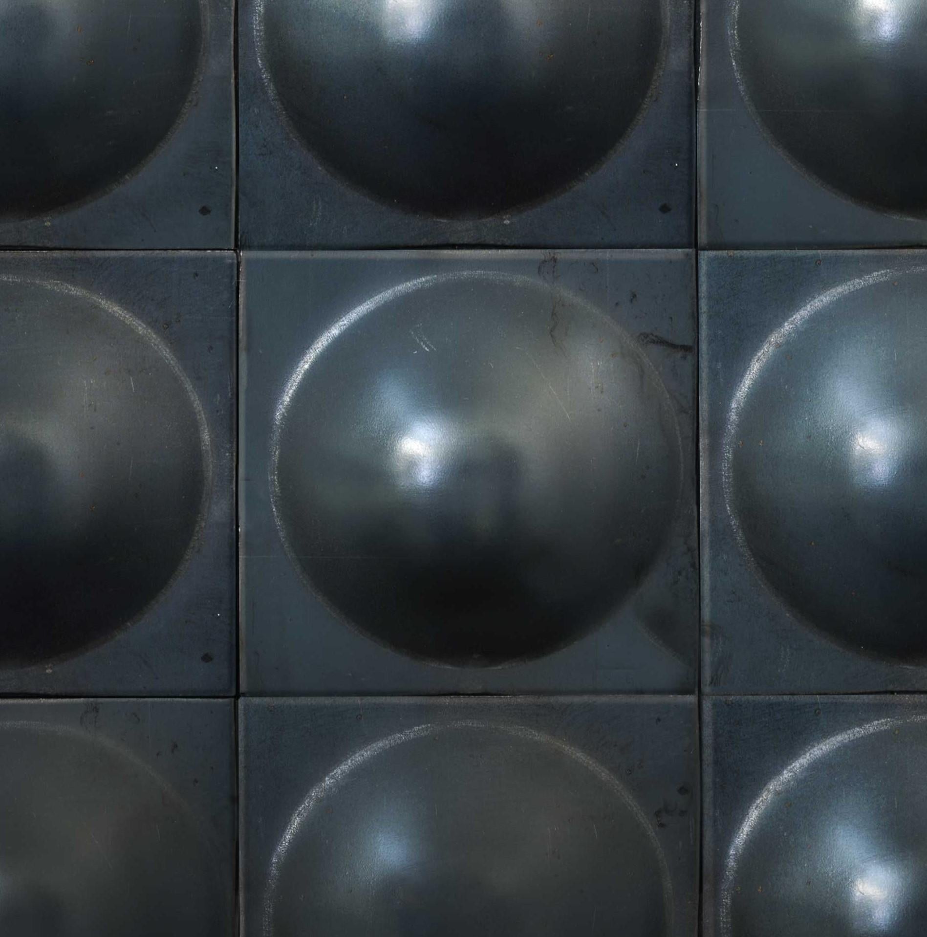 Hobnail tile wall piece by Gentner Design
Dimensions: D 30 x H 40 cm
Materials: steel

Hand-formed from a sheet of steel, emphasizing the material’s pliable characteristics expressed through the process of production, each piece is then darkened