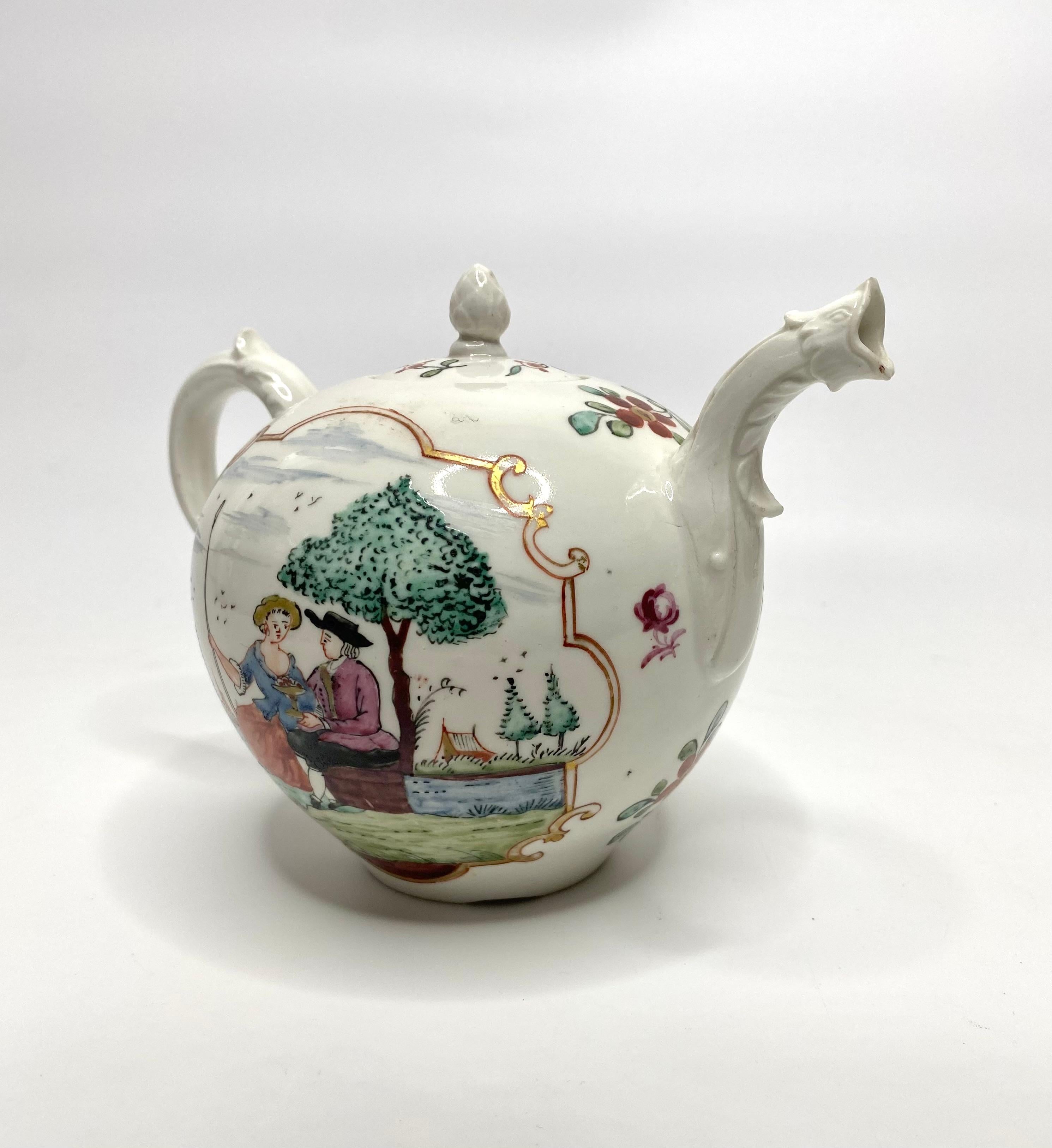 Hochst porcelain teapot and cover, c. 1755. The globular body, hand painted with a farmer and a shepherdess, seated beneath a tree, on a riverbank. The man holds a footed bowl of fruit; all within red lined, gilt scrollwork panels. Sprays of flowers