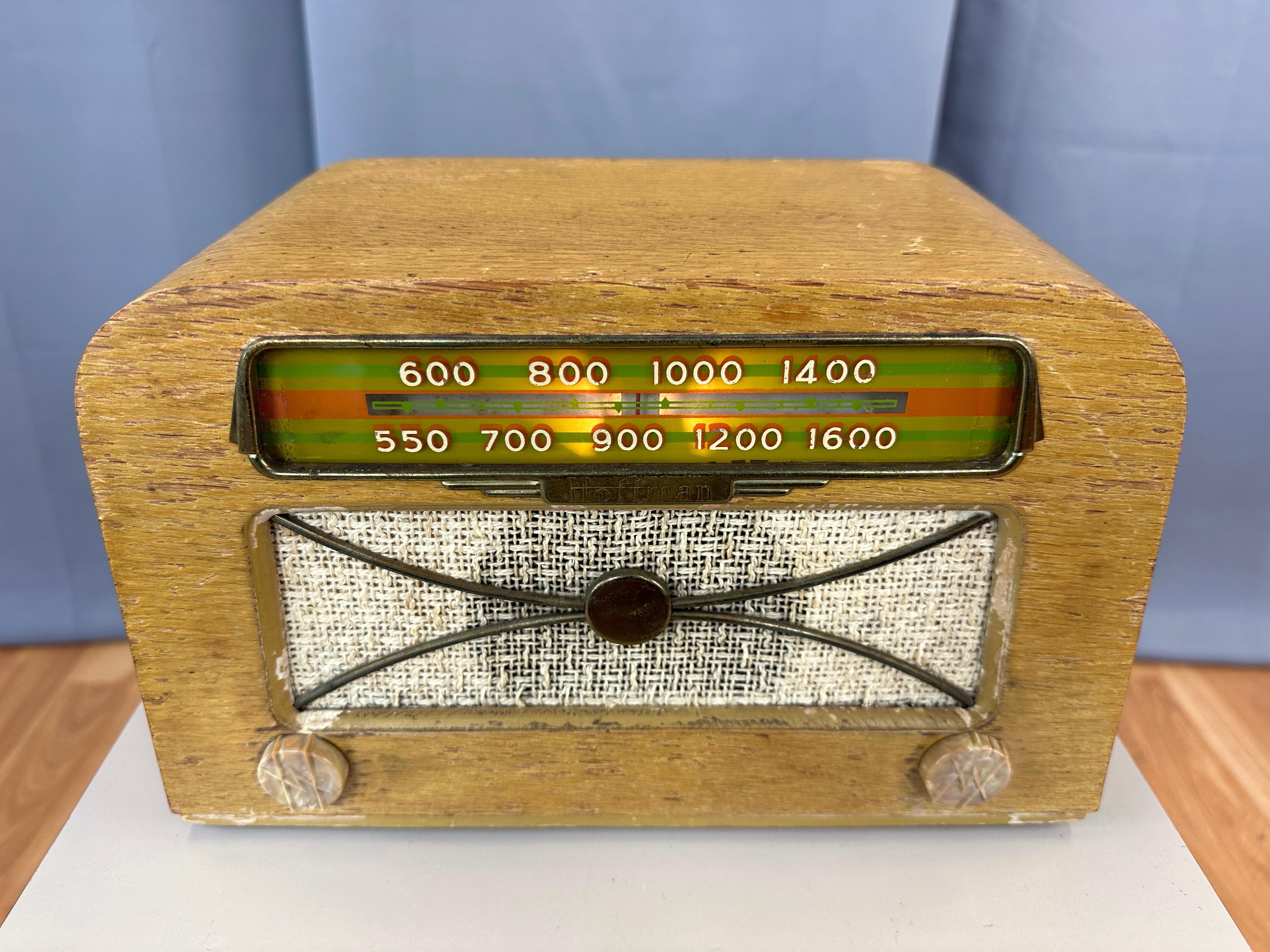 A rare—and rarer still, fully functional��—mid-century modern Hoffman Radio Corp. model A-309 tabletop tube radio designed in 1946 by Charles and Ray Eames, and produced in association with Evans Products Company in 1946–47.

Bentwood case with