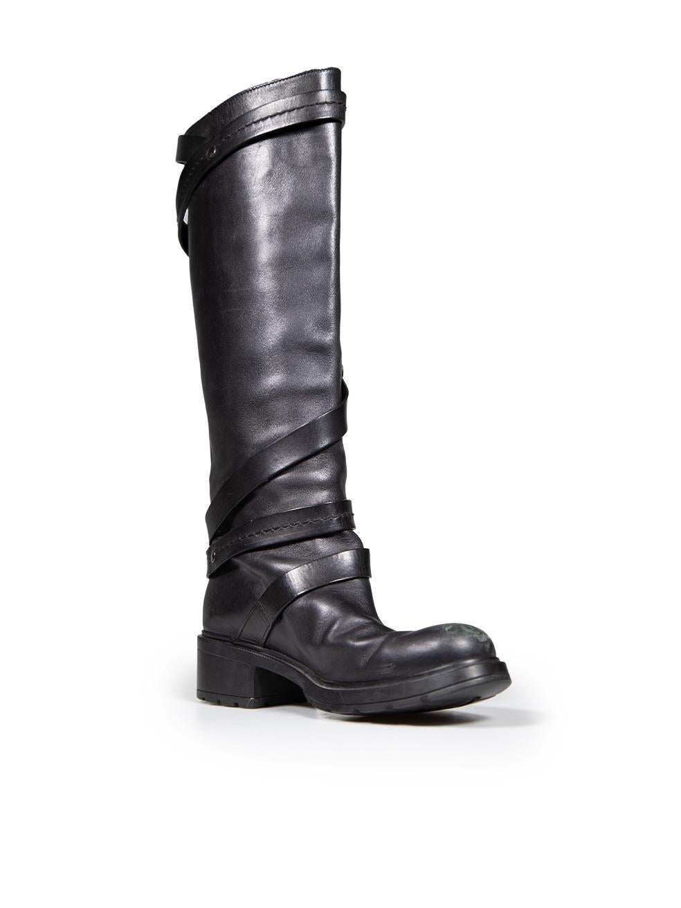 CONDITION is Good. General wear to boots is evident. Moderate signs of abrasions and scratches to the tip of both shoes as well as creasing to the the front. Minimal abrasion to the rear of both shoes and buckle strap on right shoe on this used