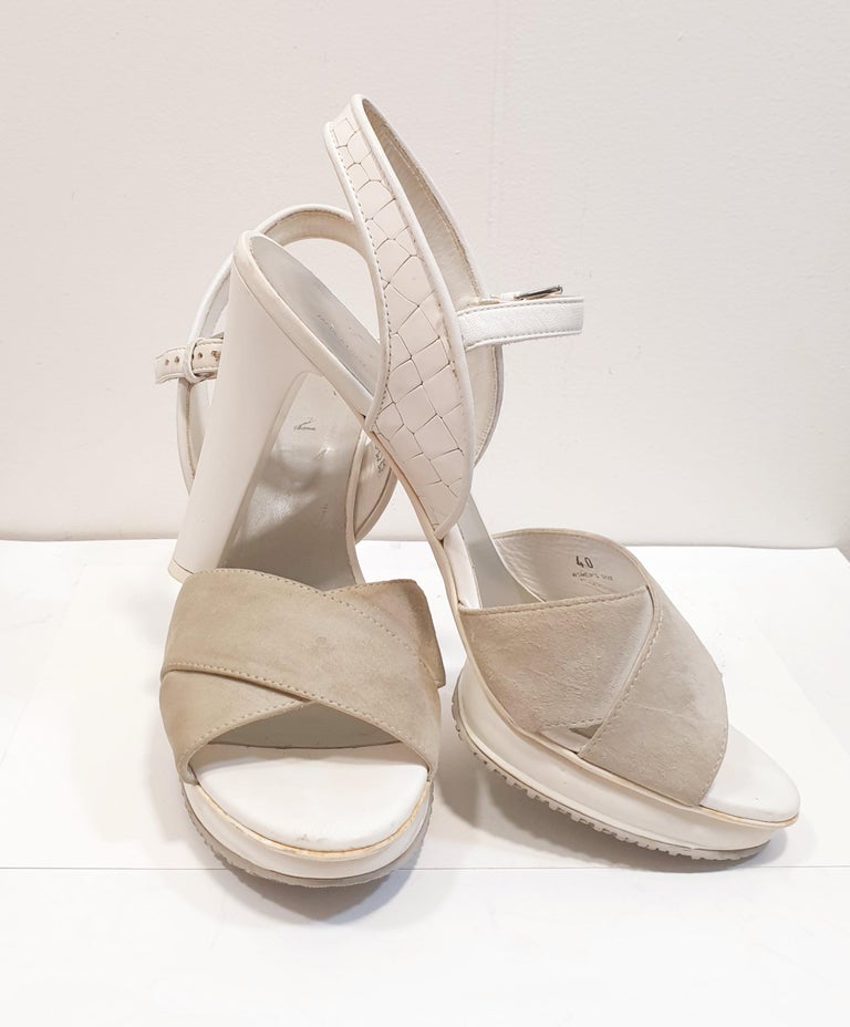Hogan Leather Sandals
Suede effect, no appliqués, two-tone pattern, , square heel, covered heel, leather lining, rubber sole, contains non-textile parts of animal origin.
Made In: Italy
Color: White and Kakhi
Materials:  Leather/ Suede
Sole: