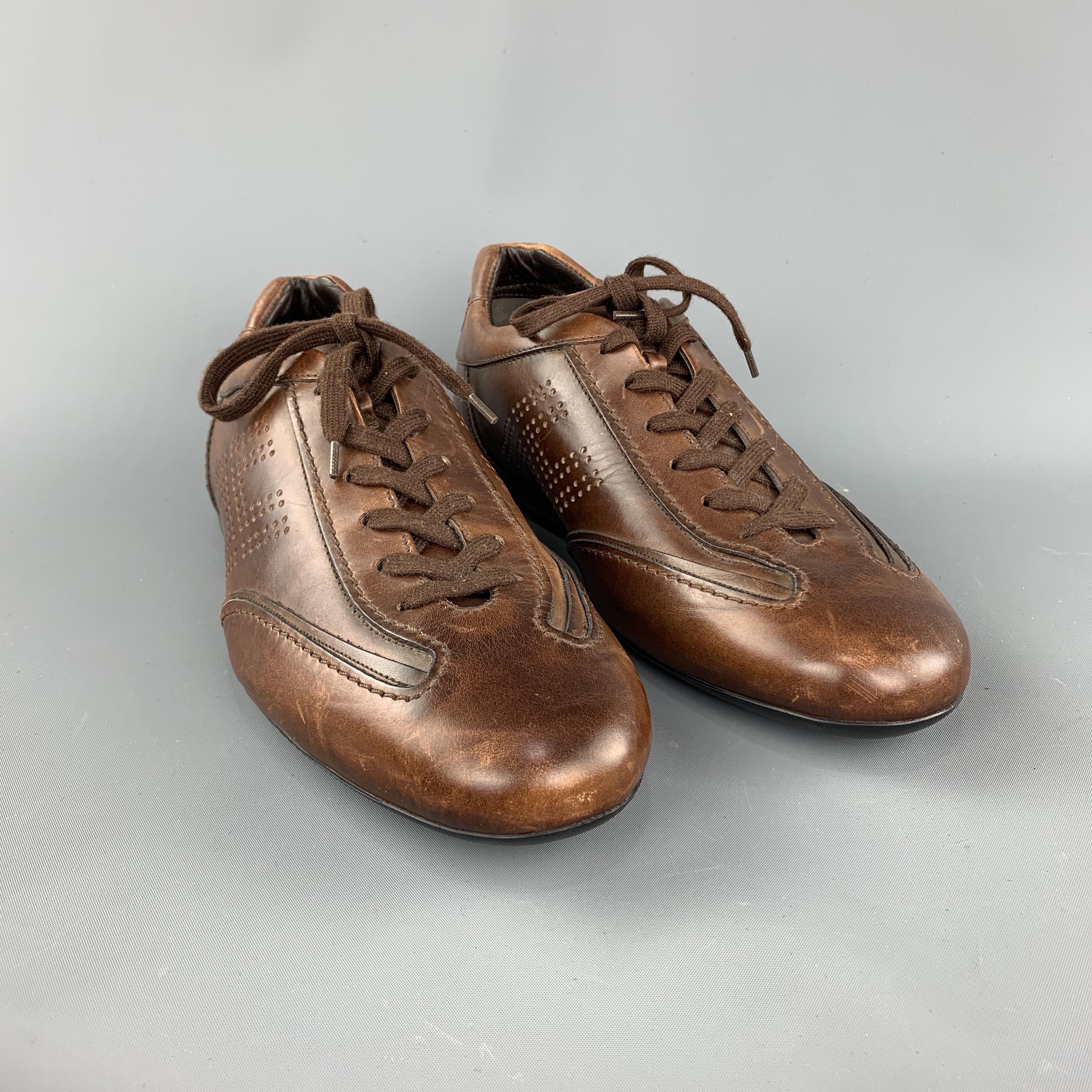 HOGAN lace up shoe comes in a brown perforated leather featuring a lace up style and a rubber sole. Made in Italy.
 
Excellent Pre-Owned Condition.
Marked: 10
 
Measurements:
 
Outsole: 12.5 in x 4.5 in.