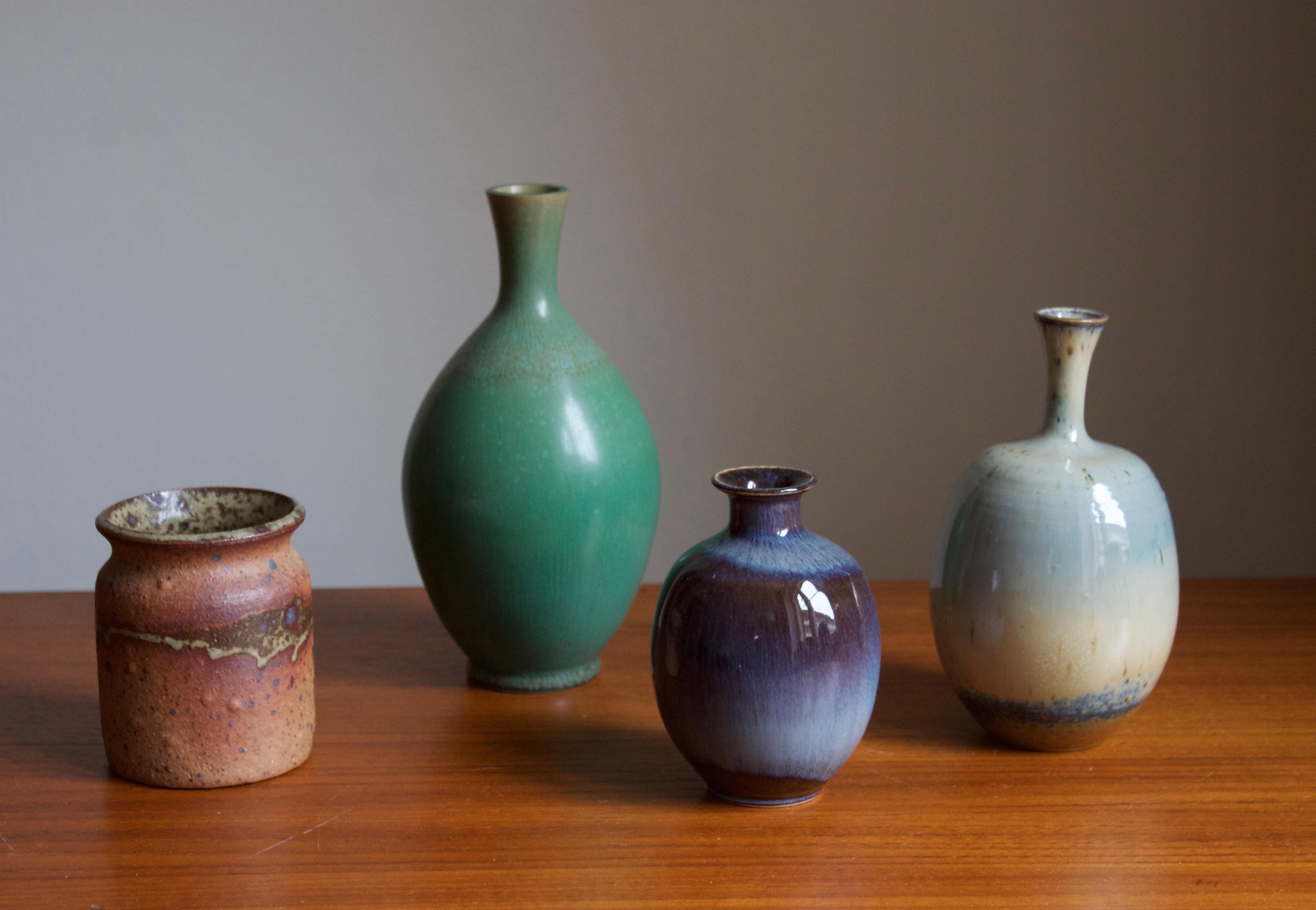 A set of 4 vases. 3 by höganäs keramik, designed by amongst other Kjell Bolinder. One vase by Rolf Palm, Mölle, Höganäs.