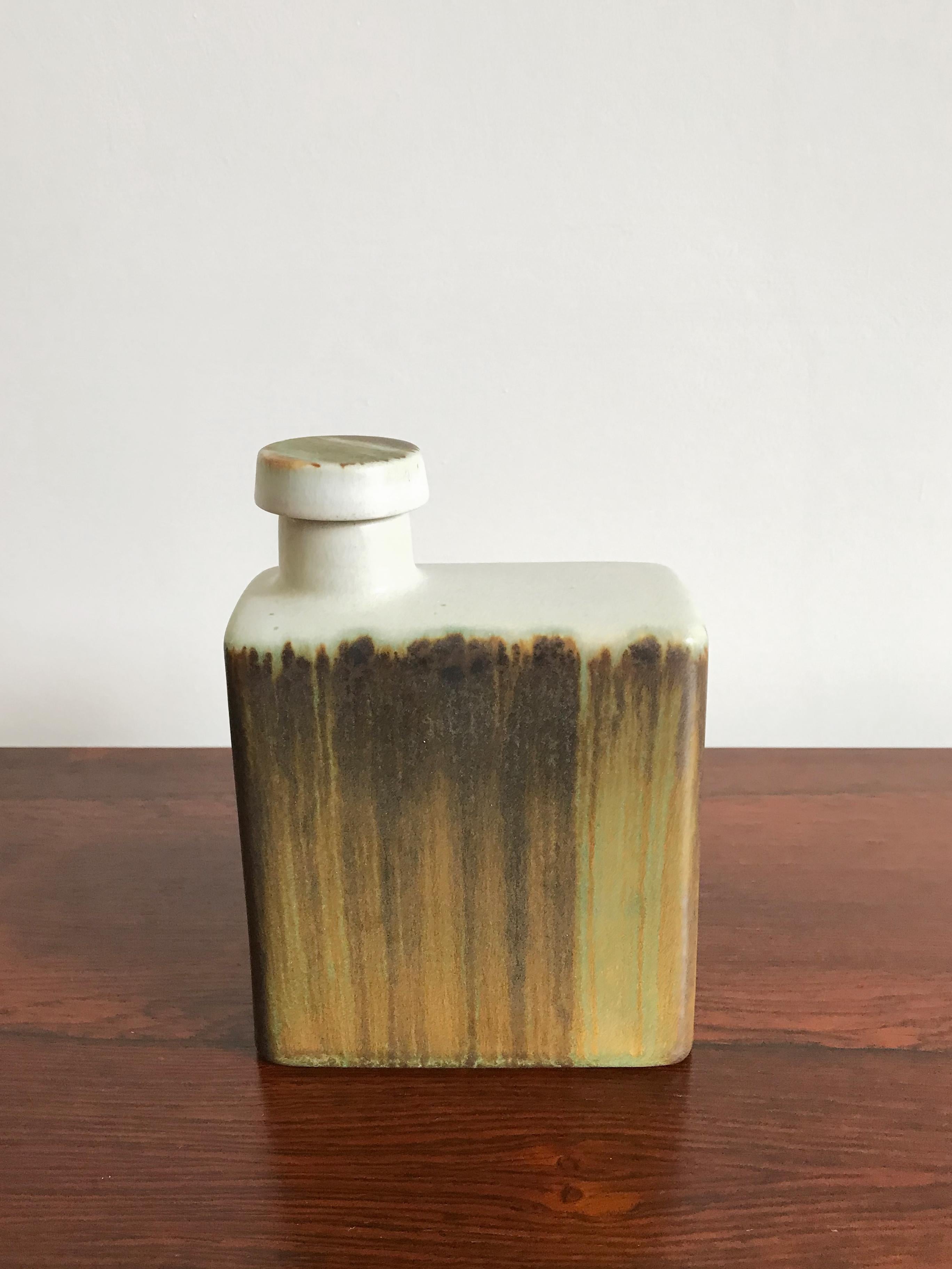 Scandinavian Mid-Century Modern design ceramic bottle with cup produced by Höganäs Keramik with stamp under the base, Sweden circa 1960s.