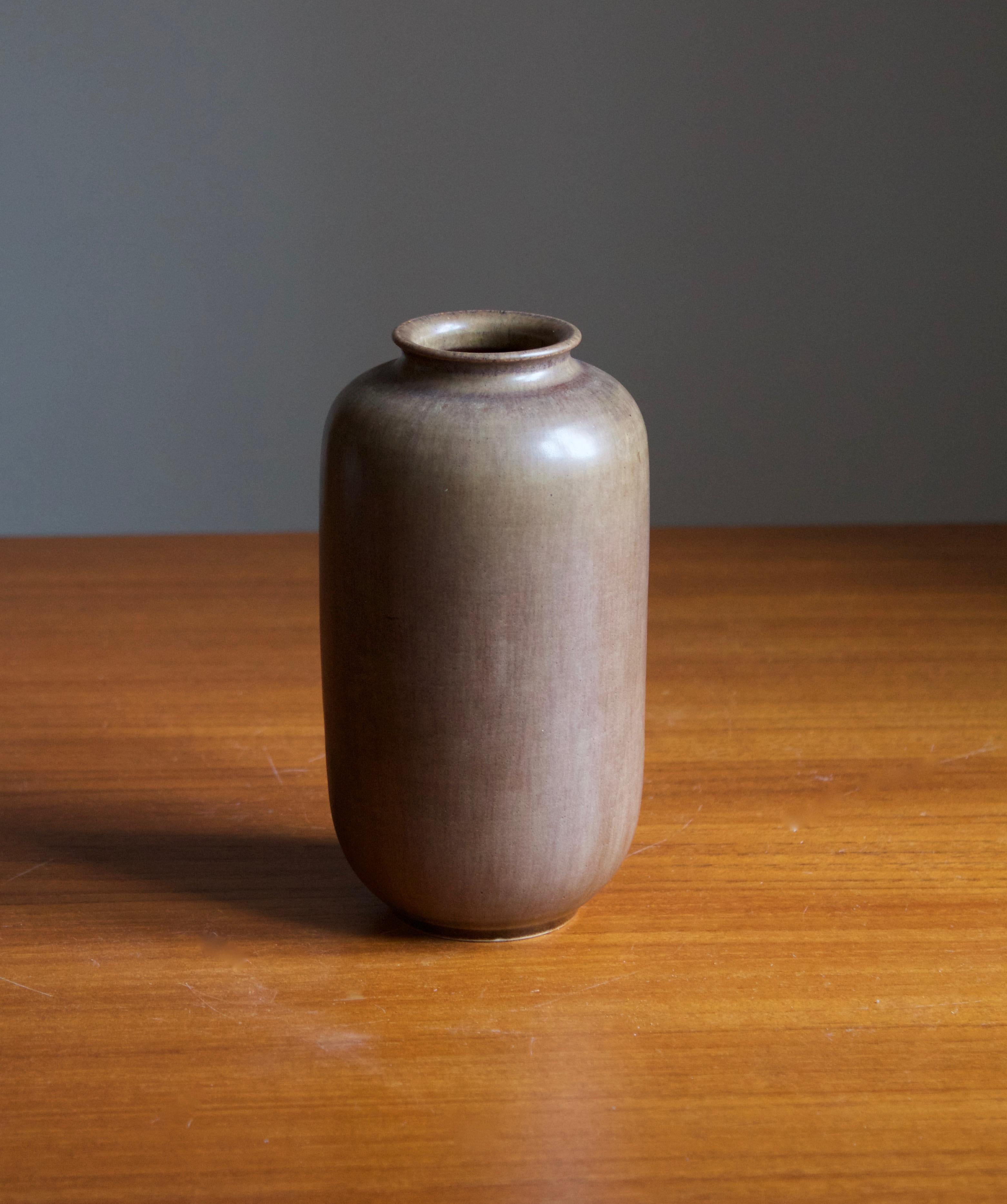 A vase, by Höganäs Keramik. Features a highly artistic glaze. Stamped.

