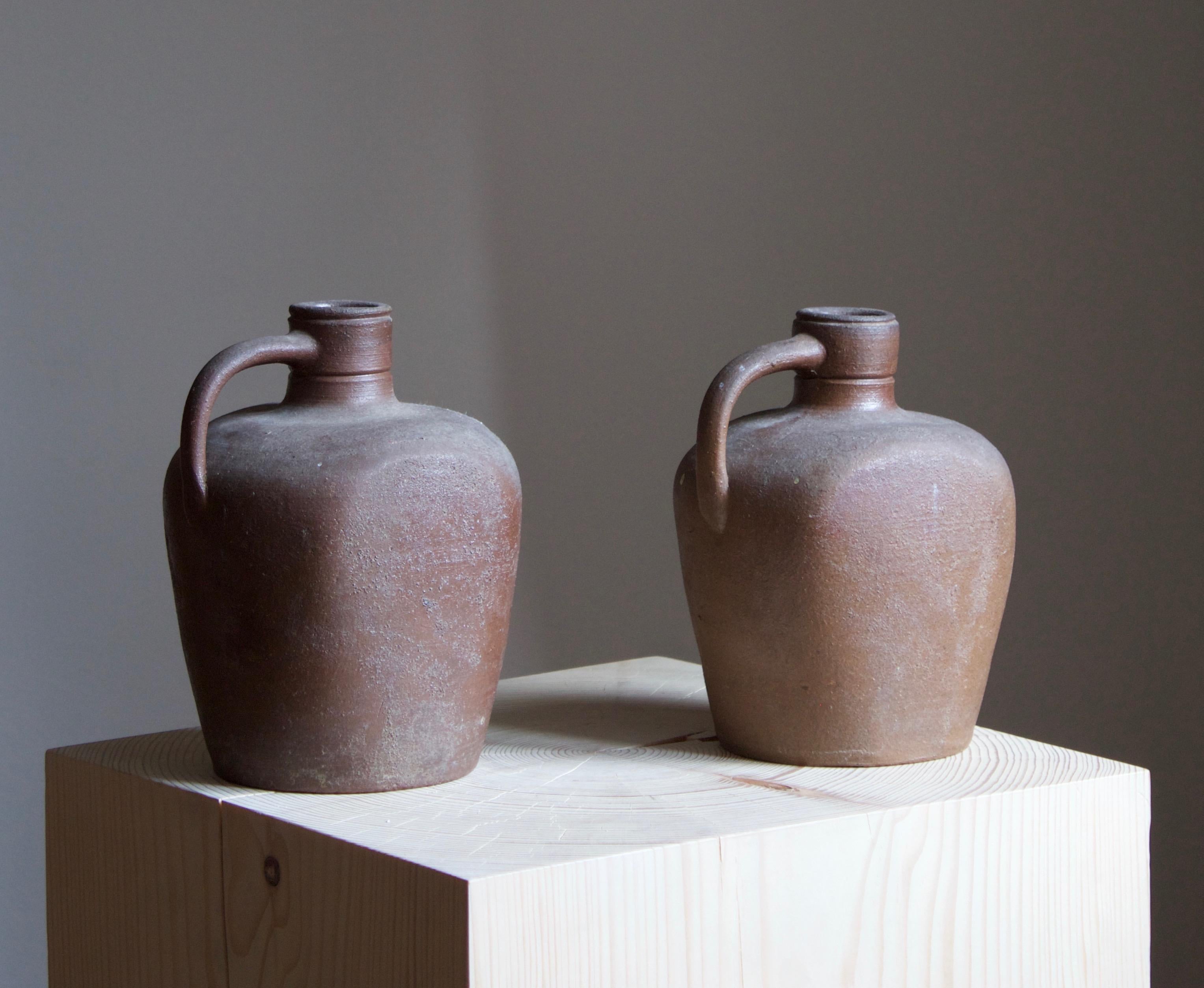 A pair of vases / bottles by Höganäs Keramik. Stamped.