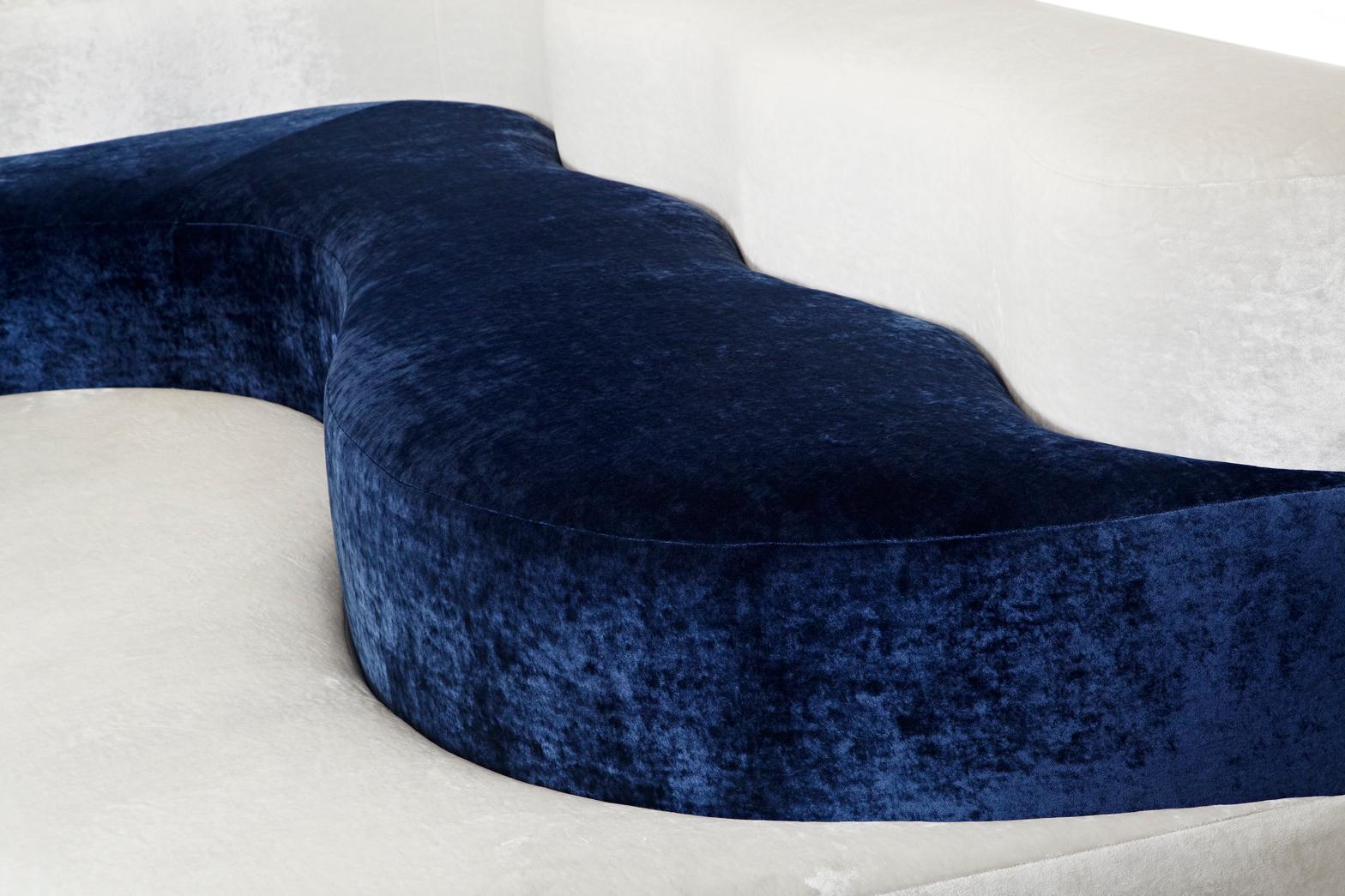 The Holas banquette creates a sleek and modern seating arrangement with its beautifully sculpted waving shape. Upholstered in luxurious velvet and deeply padded for comfort, the it is sure to provide countless hours of comfort.
