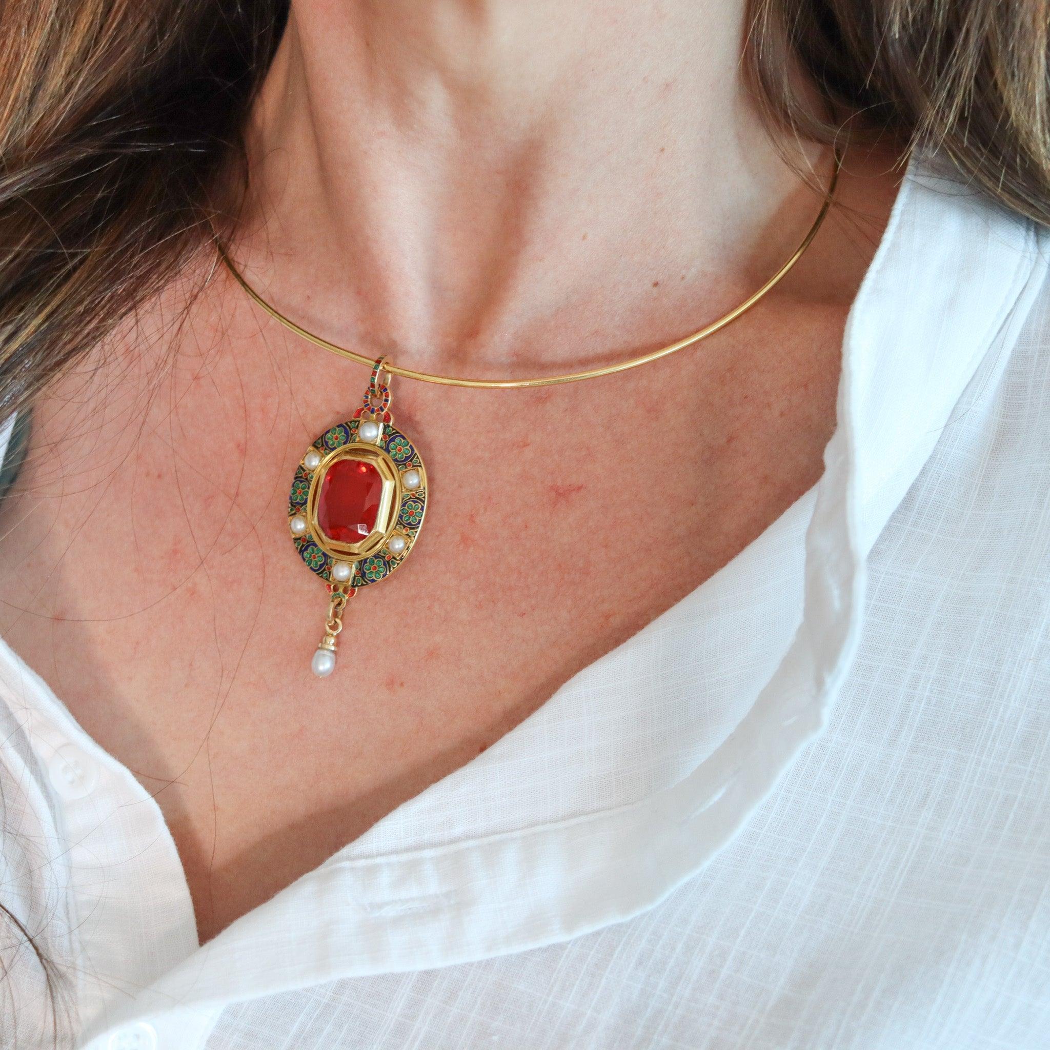 Holbeinesque enameled pendant with natural pearls and fire-opal.

This is a fabulous Victorian Holbeinesque pendant attributed to Russell and created in England back in 1860. The rare and important pendant has been crafted in solid yellow gold of 19