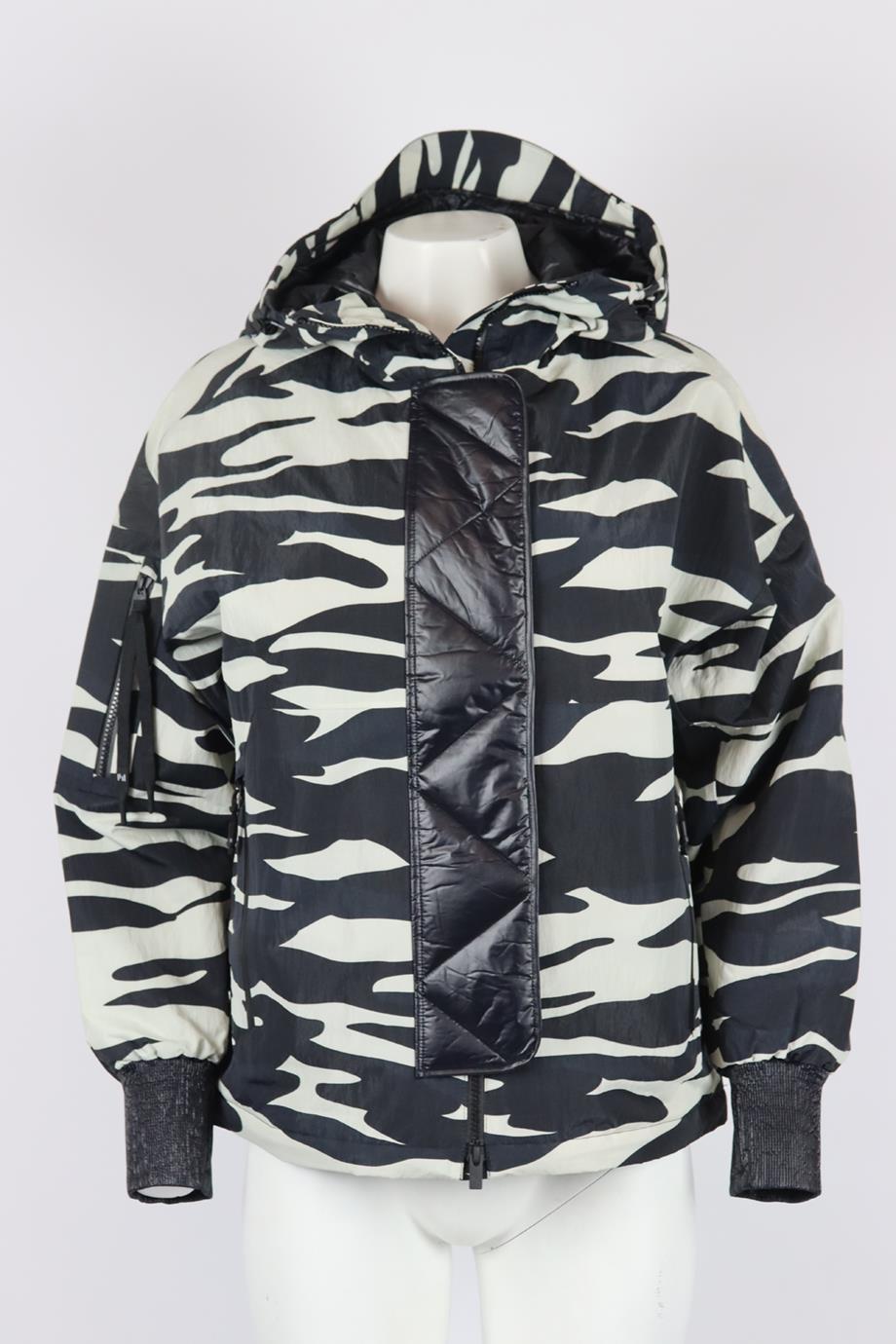 Holden hooded zebra print shell jacket. Black and white. Long sleeve, turtleneck. Zip fastening at front. 64% Recycled nylon, 36% nylon; fabric2: 100% nylon; lining: 100% nylon. Size: XSmall (UK 6, US 2, FR 34, IT 38). Shoulder to shoulder: 23 in.
