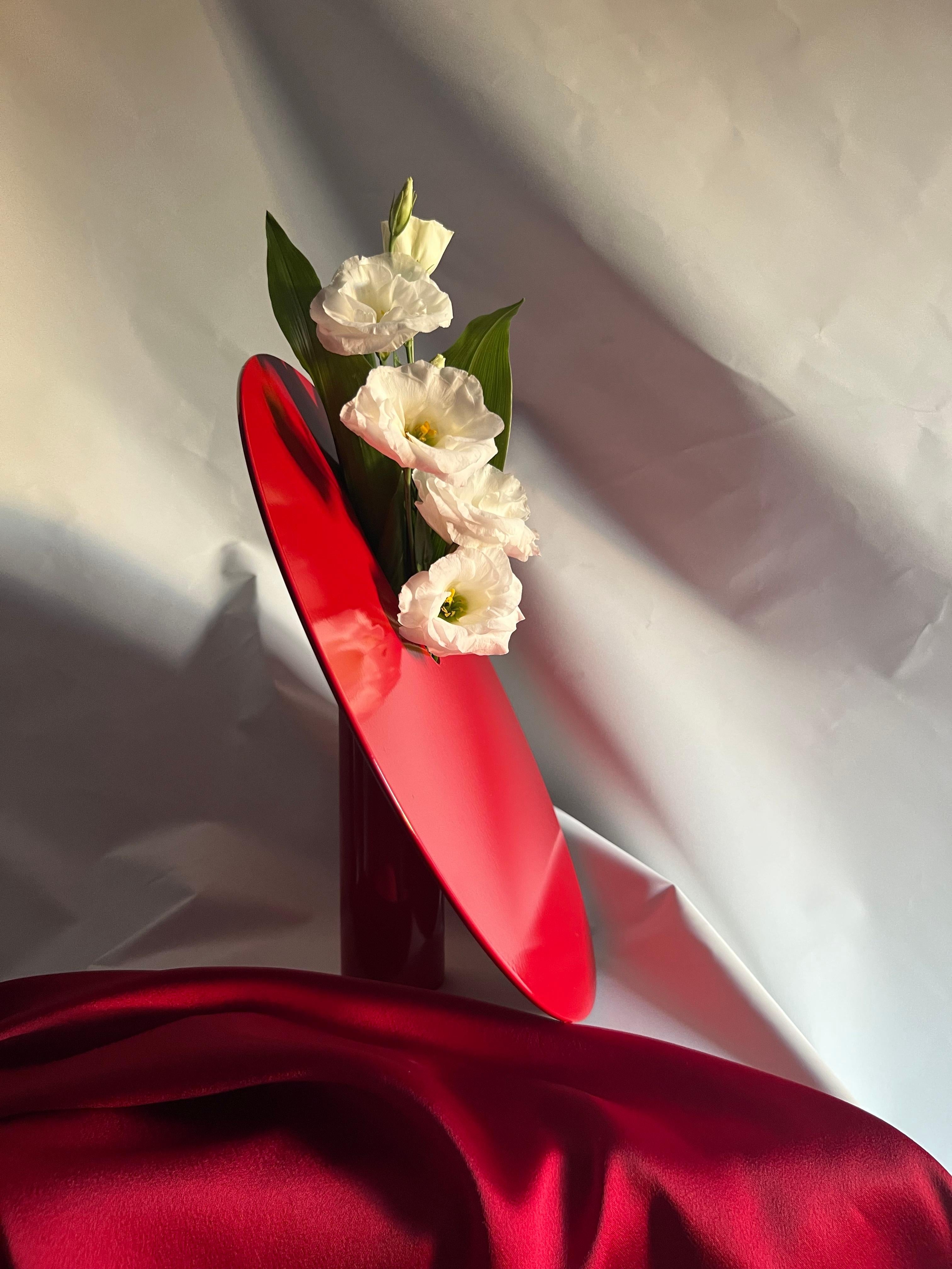 Hole red vase by Shou
Dimensions: D 40 x H 35 cm
Materials: Stainless steel and electrostatic coated steel
Colour: Red

'Hole' vase inspired by the obscurity of the universe and black holes. The circular shape represents the galaxy, the