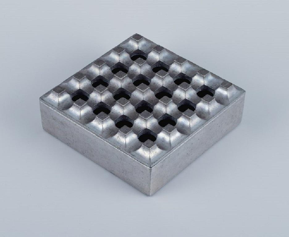 Holger Bäckström and Bo Ljungberg for AKVAMATIK AB, Tranås, Sweden.
ULTIMA 15 ashtray in steel, Swedish design.
Approx. 1970s.
Excellent condition with minor signs of use.
Measurements: 15 cm. x 15 cm. x 5 cm.