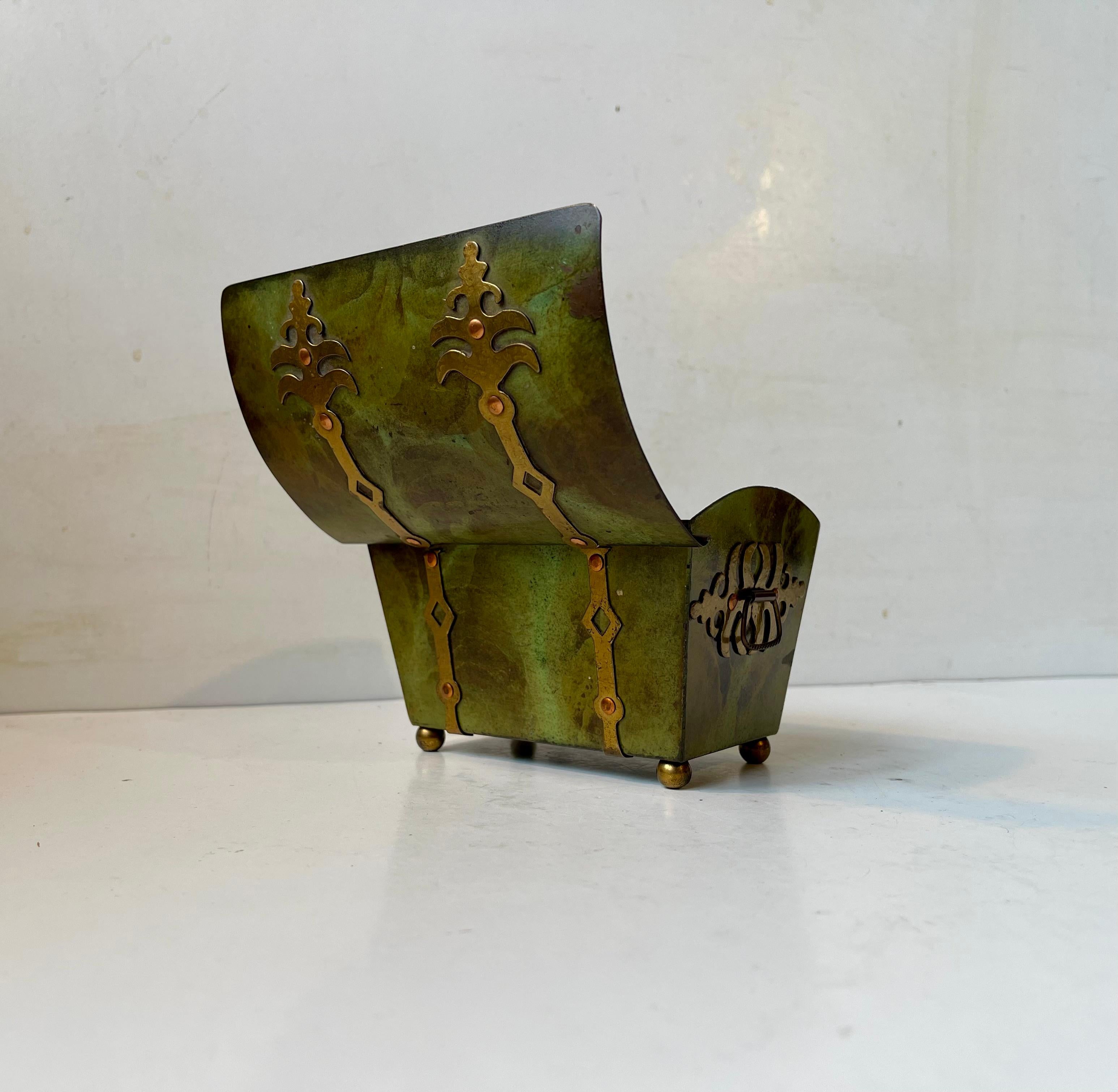 Thin stocked small scaled treasure chest - casket box in bronze applied green verdigris patina (cold paint). Suitable for storing small personal 'treasures' like jewelry, tea, tobacco etc. It was designed and manufactured by Holger Fridericias in
