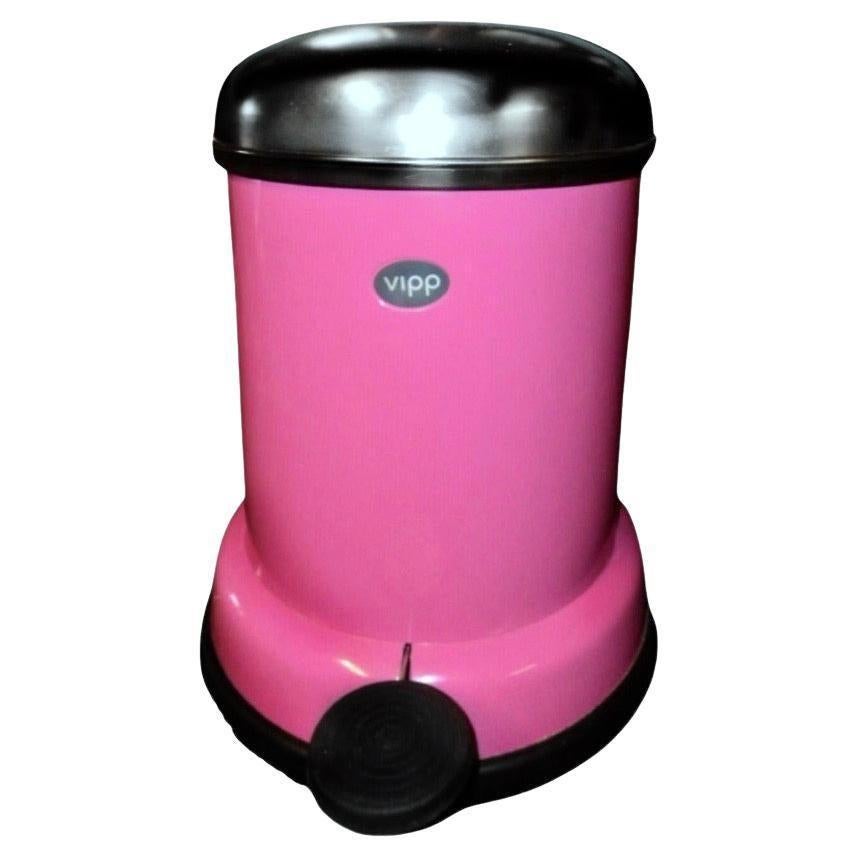 Holger Nielsen VIPP Denmark Carnation Pink Step Wastebin Trashcan, Denmark, 1939. The Vipp story begins in 1939 with a bin for Marie. Holger Nielsen, a young metalworker crafts a sturdy, pedal-controlled bin for his wife's salon (see final image).