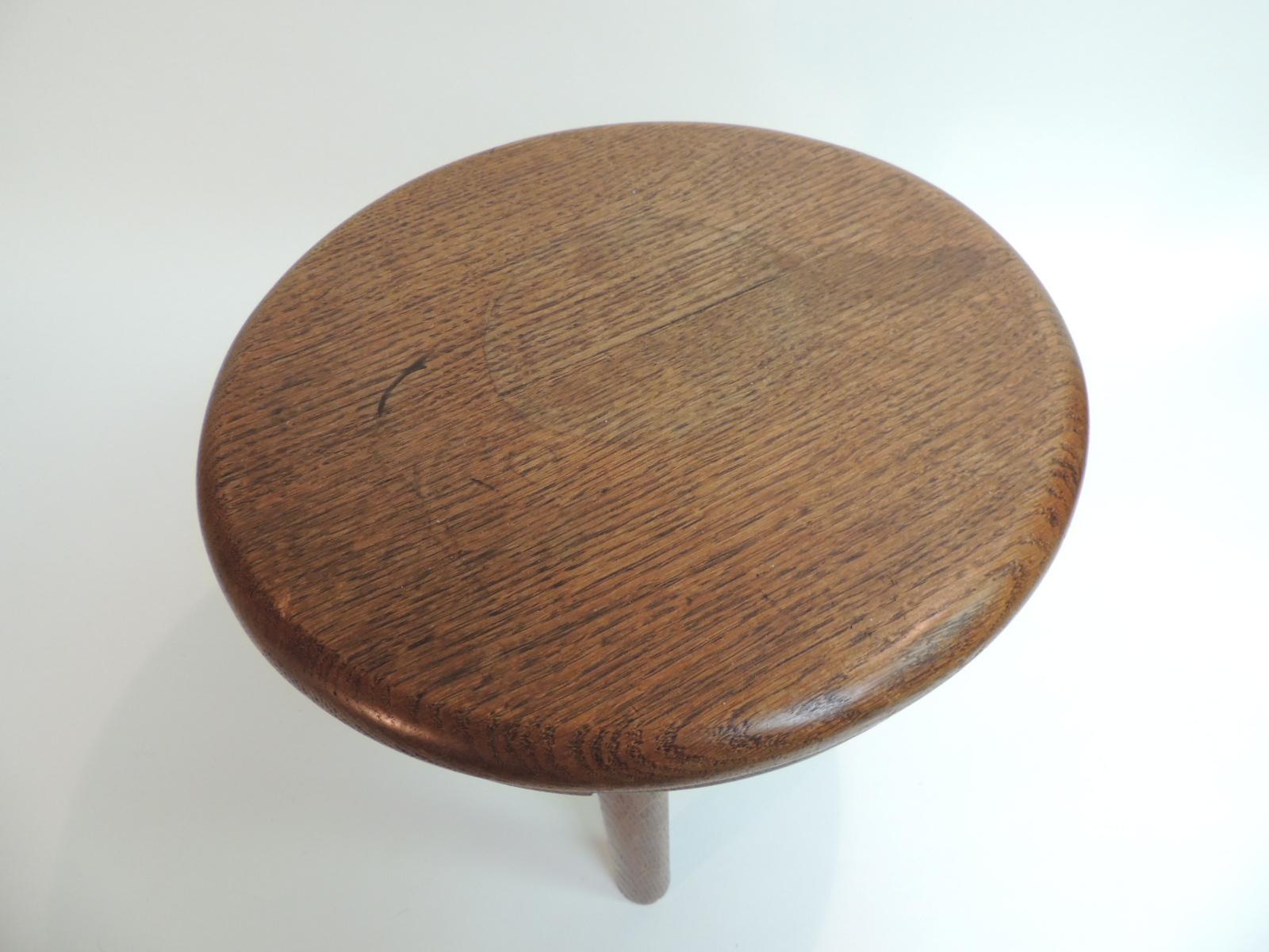 Vintage round Mid-Century Modern low stool or table.
Mid-Century Modern honey color stained, three leg low telephone table or stool.
Wood grain with round tripod legs.
French, 1960s.
Size: 13.5 x 12.5 H.

.