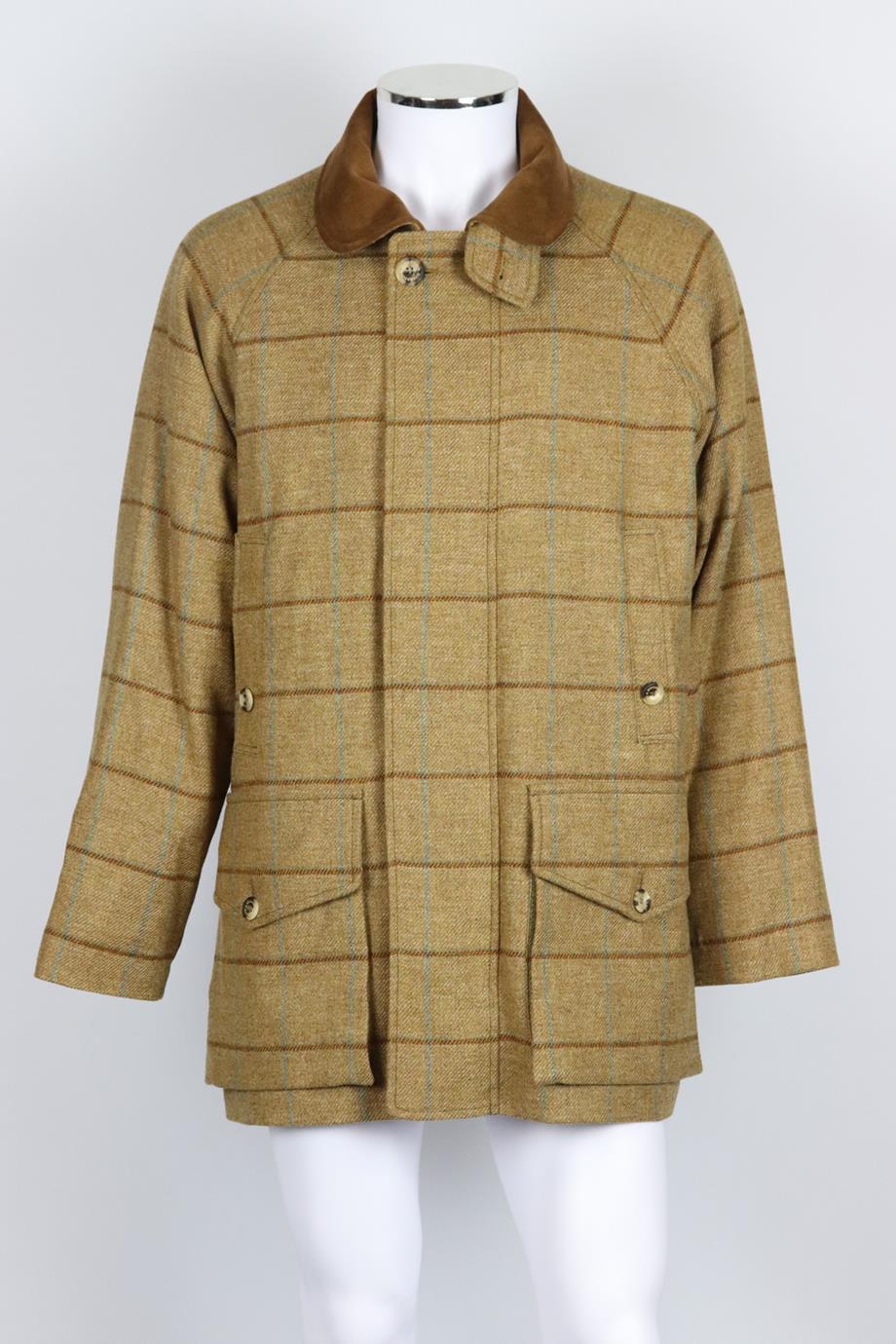Holland & Holland men's checked wool blend tweed coat. Tan, brown and blue. Long sleeve, crewneck. Zip and button fastening at front. 100% Wool; lining: 100% cotton; filling: 100% polyurethane. Size: Medium (IT 48, EU 48, UK/US Chest 38). Shoulder