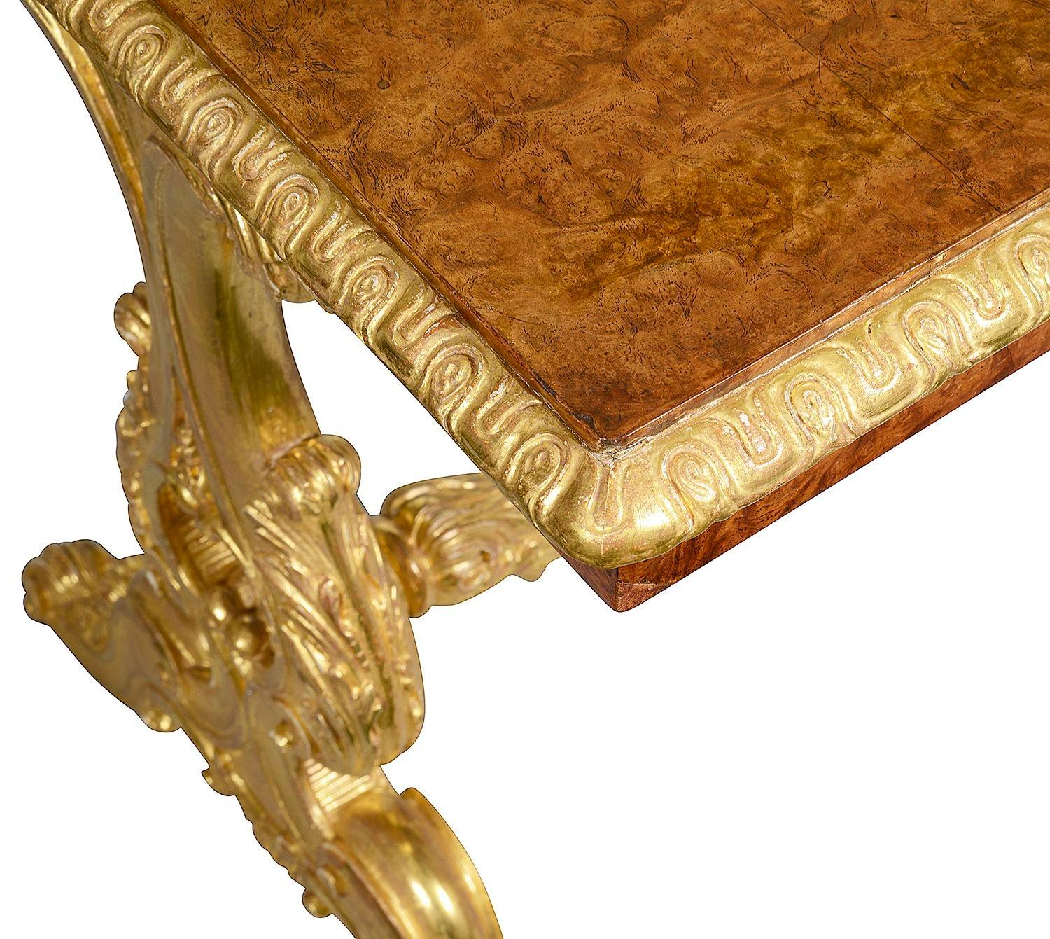 A fine quality 19th Century Birdseye Maple and carved Giltwood Centre table. Having wonderful gadrooned moulding to the top, scrolling foliate decoration to the end supports, united by a stretcher between and raised on elegant outswept cabriole